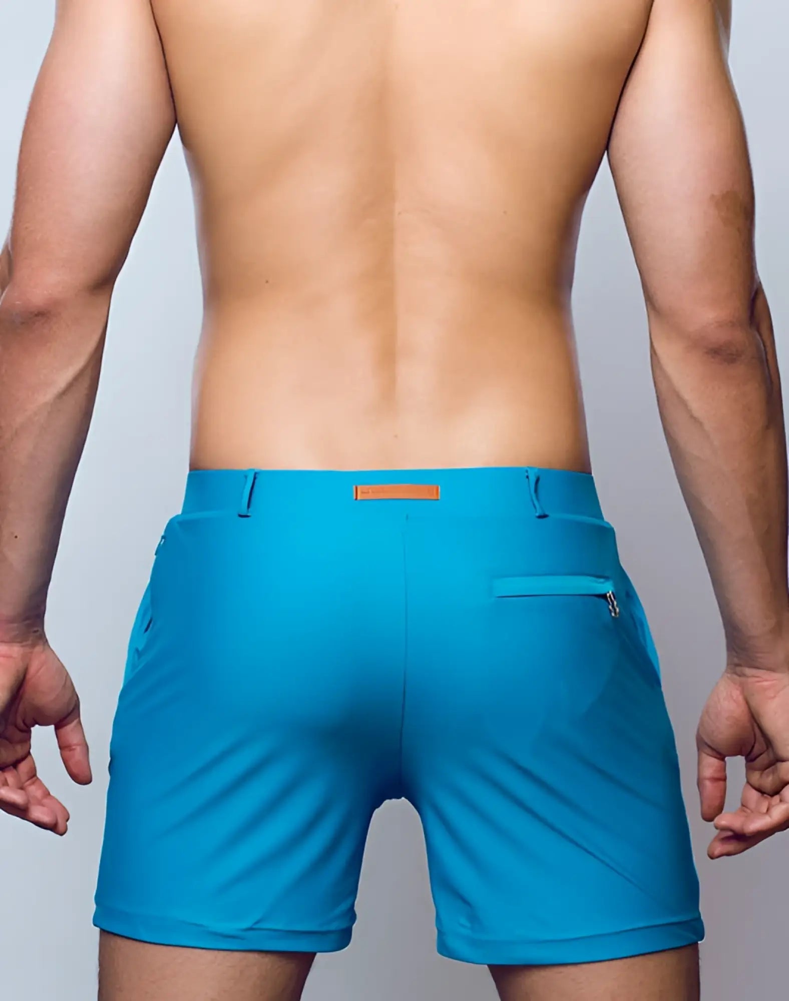 Bright turquoise breeze green 2eros bondi shorts series 3 with sleek design and brown leather waistband accent