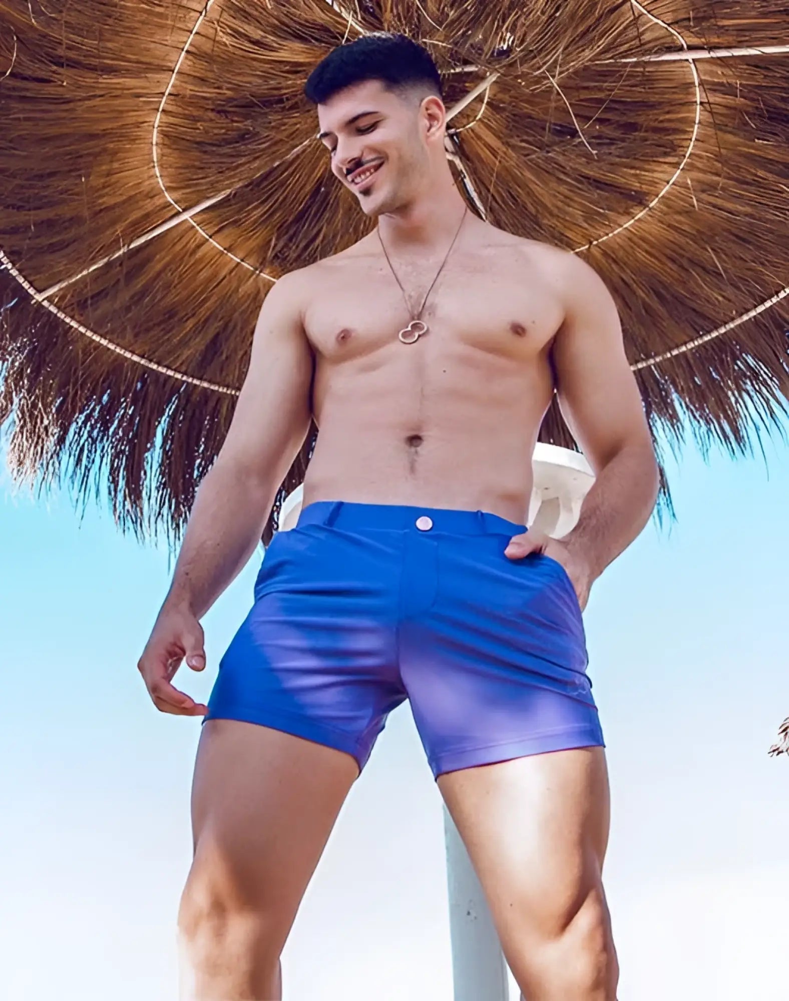Bright blue 2EROS Bondi shorts with a subtle purple gradient fade at the hem perfect for swimwear