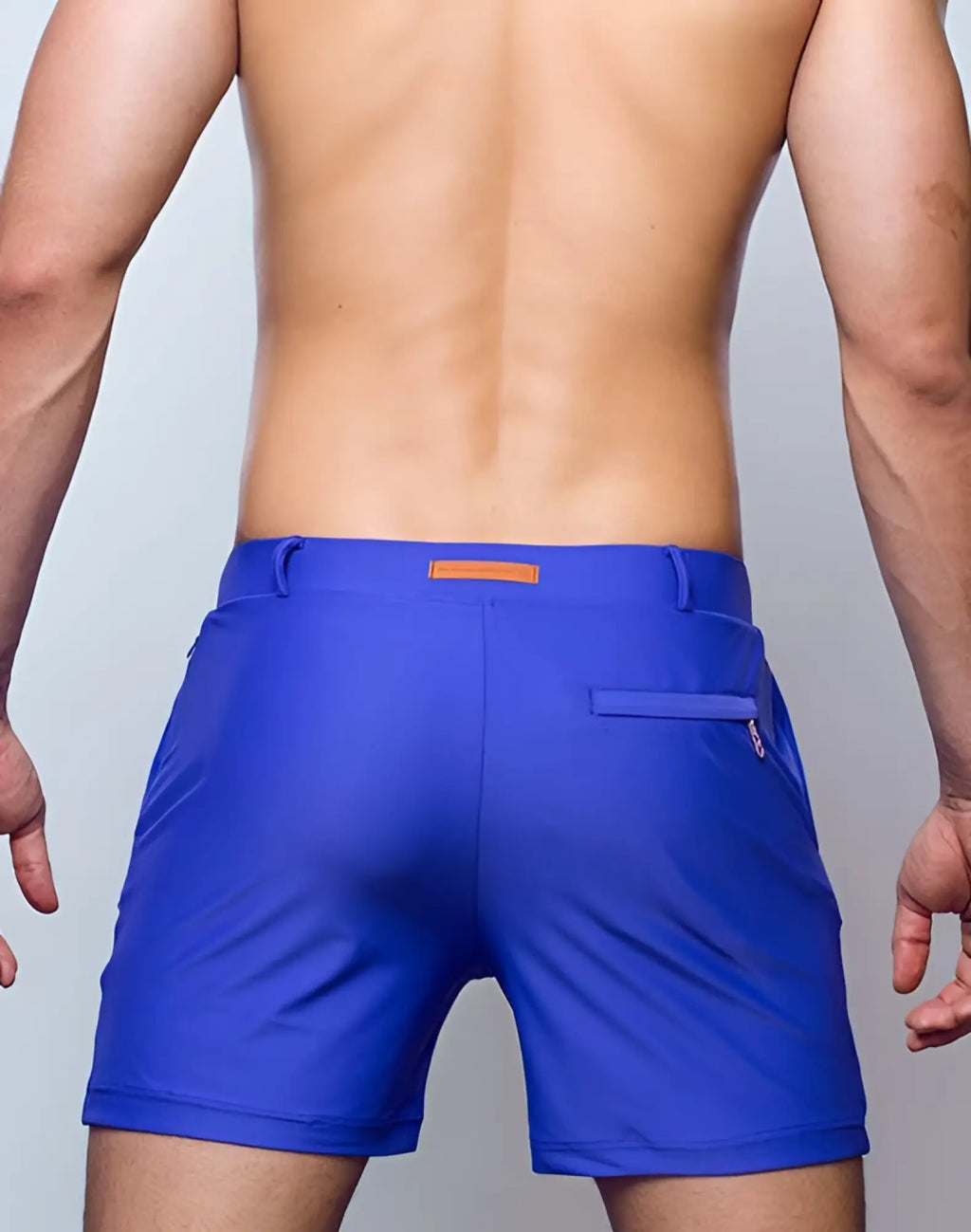 Vibrant royal blue 2EROS Bondi athletic shorts with sleek design and orange brand tag at the waistband
