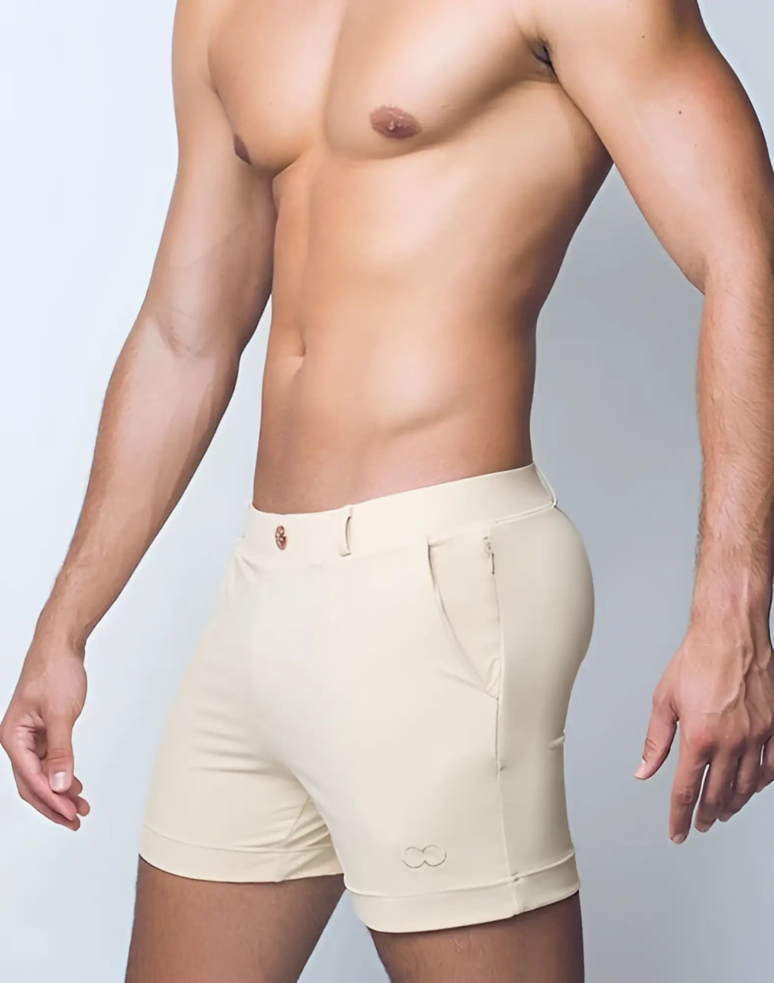 Beige 2eros bondi series 3 athletic shorts with sleek form-fitting design and subtle brand logo on lower leg in sand