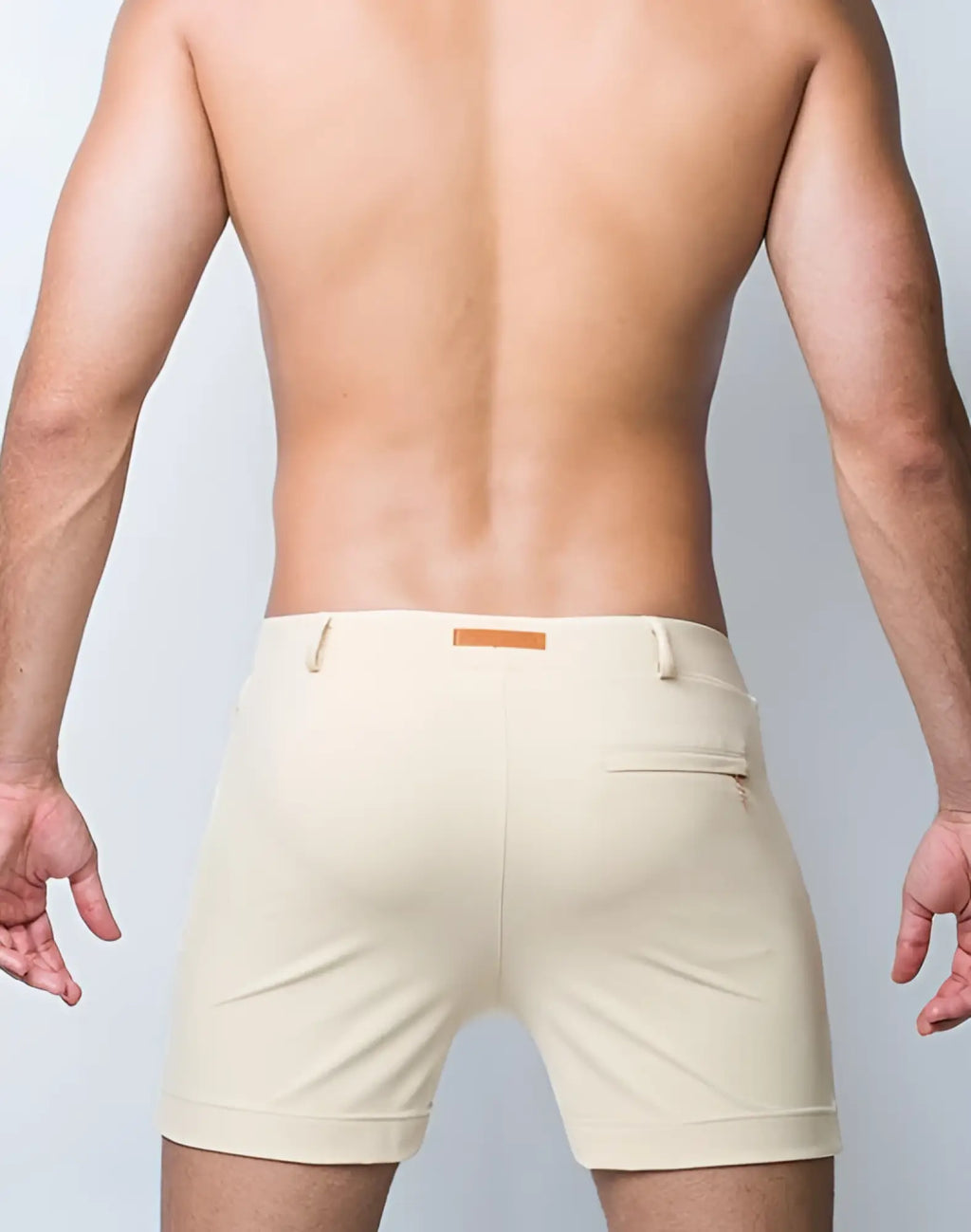 Beige 2eros bondi tailored shorts sand with subtle brown leather patch and zippered back pocket shown from the back