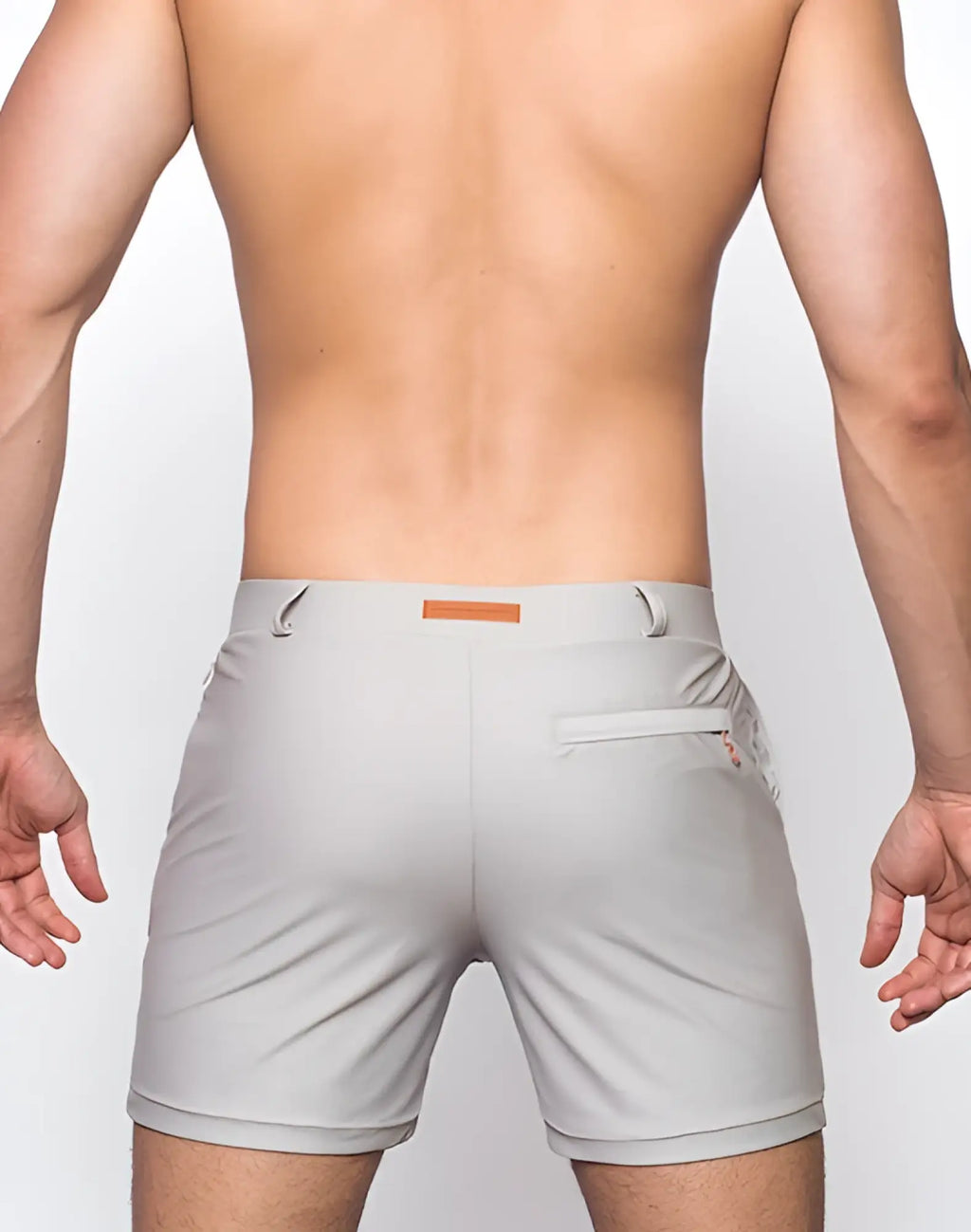 Back view of 2eros bondi shorts series 3 string brown gray textured athletic shorts with orange brand tag and zippered pocket