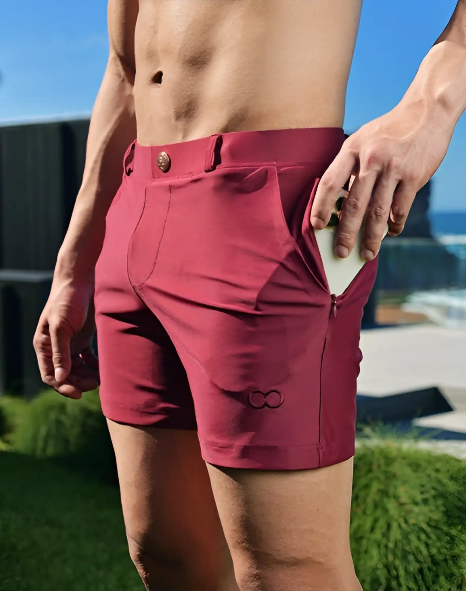 Maroon 2EROS Bondi athletic shorts with button closure and subtle brand logo on lower leg in tawny port color