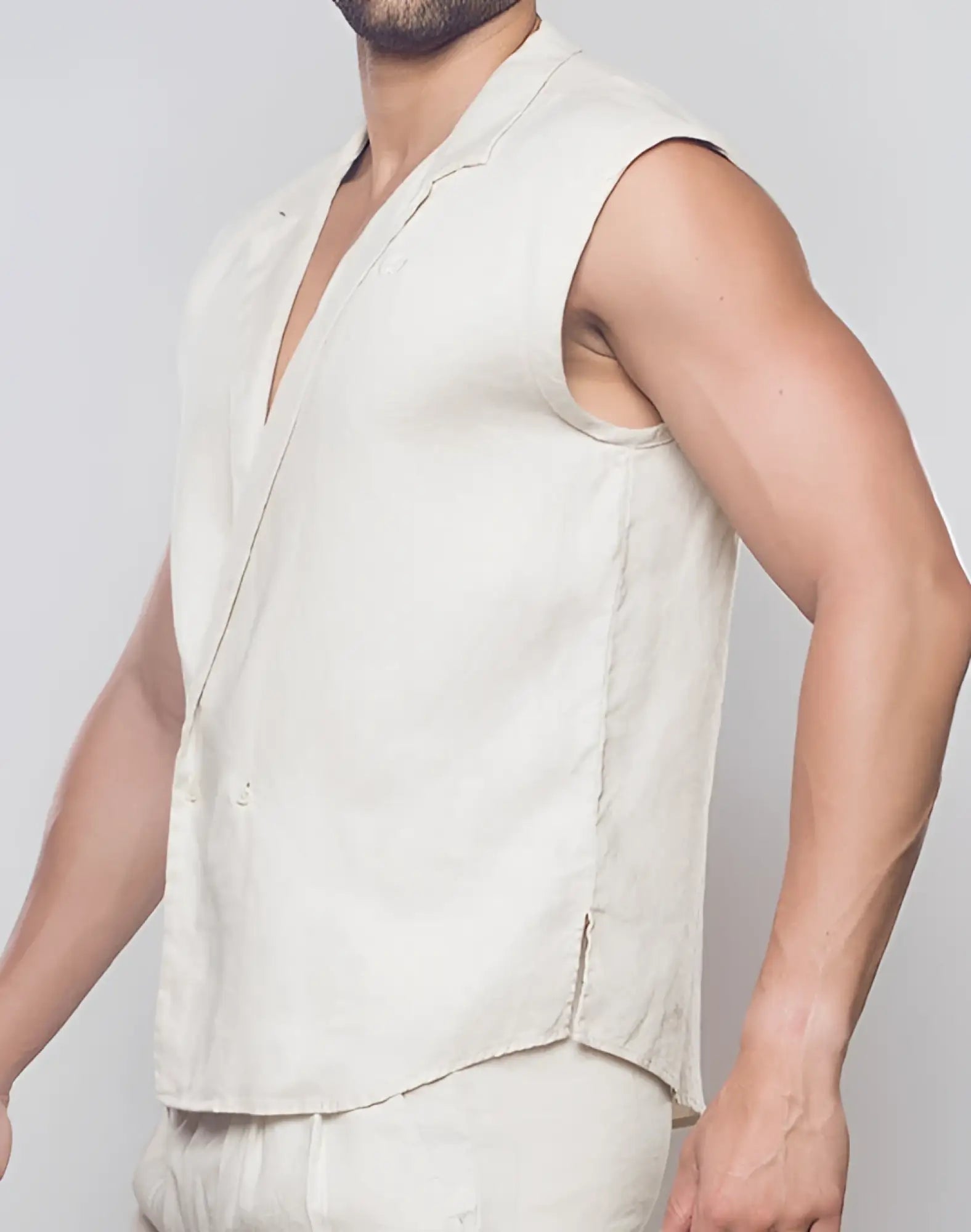A light beige sleeveless linen vest with v-neck and single button closure from 2EROS breezy linen collection