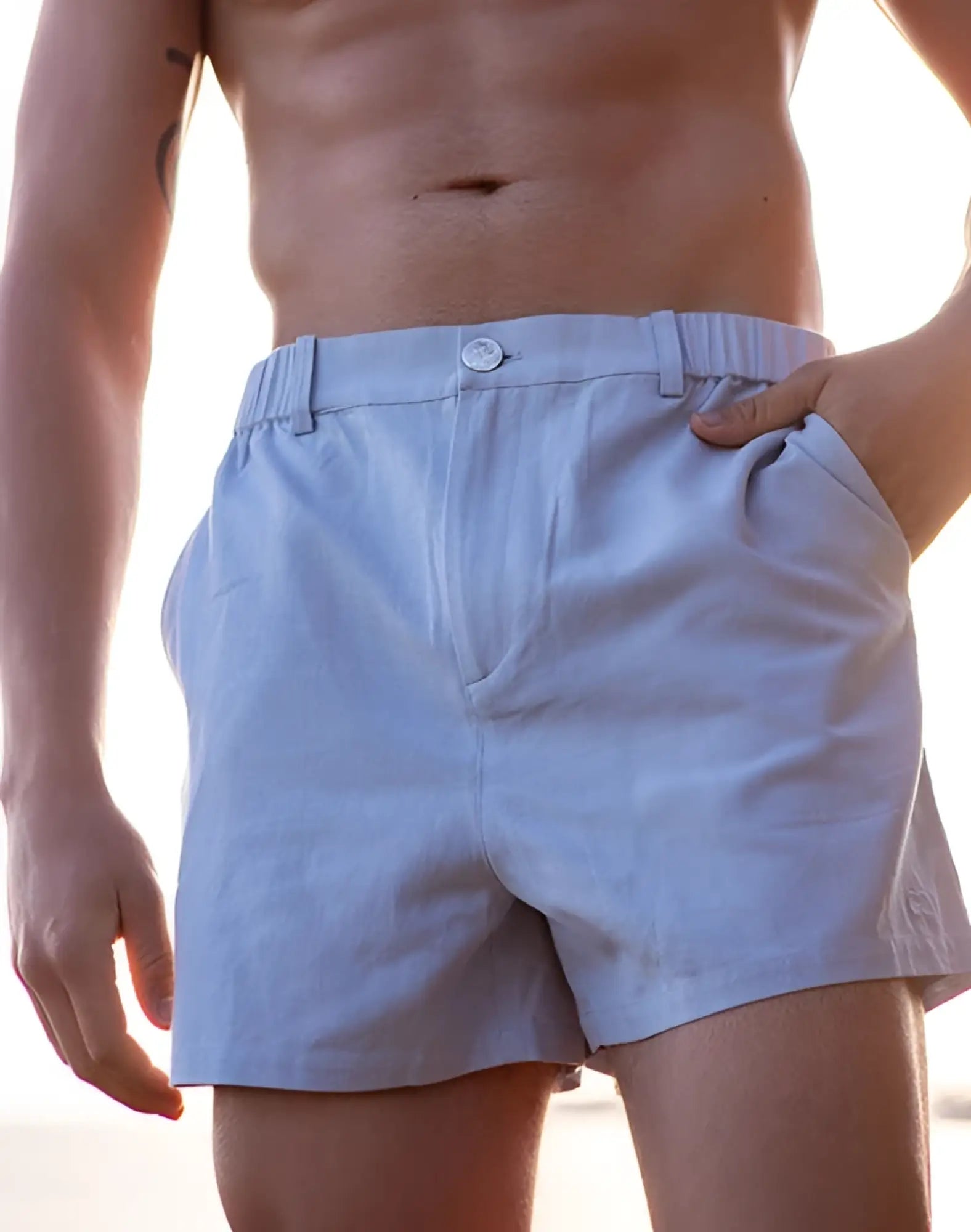 Light blue 2EROS CAPRI shorts with relaxed fit elastic waistband and button closure for casual comfort
