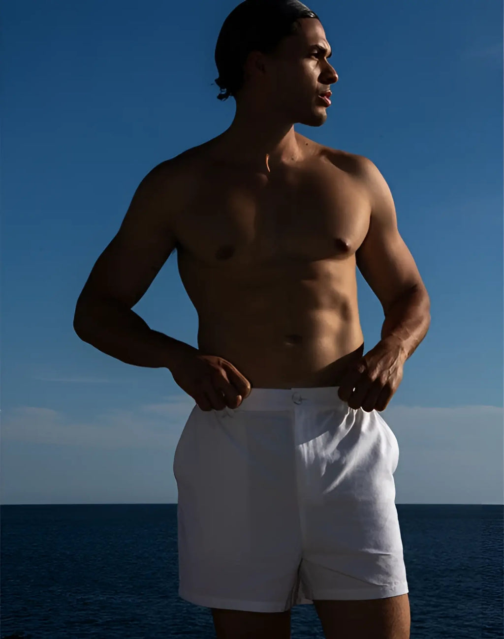 White linen 2EROS capri shorts with a clean minimalist design perfect for casual summer wear