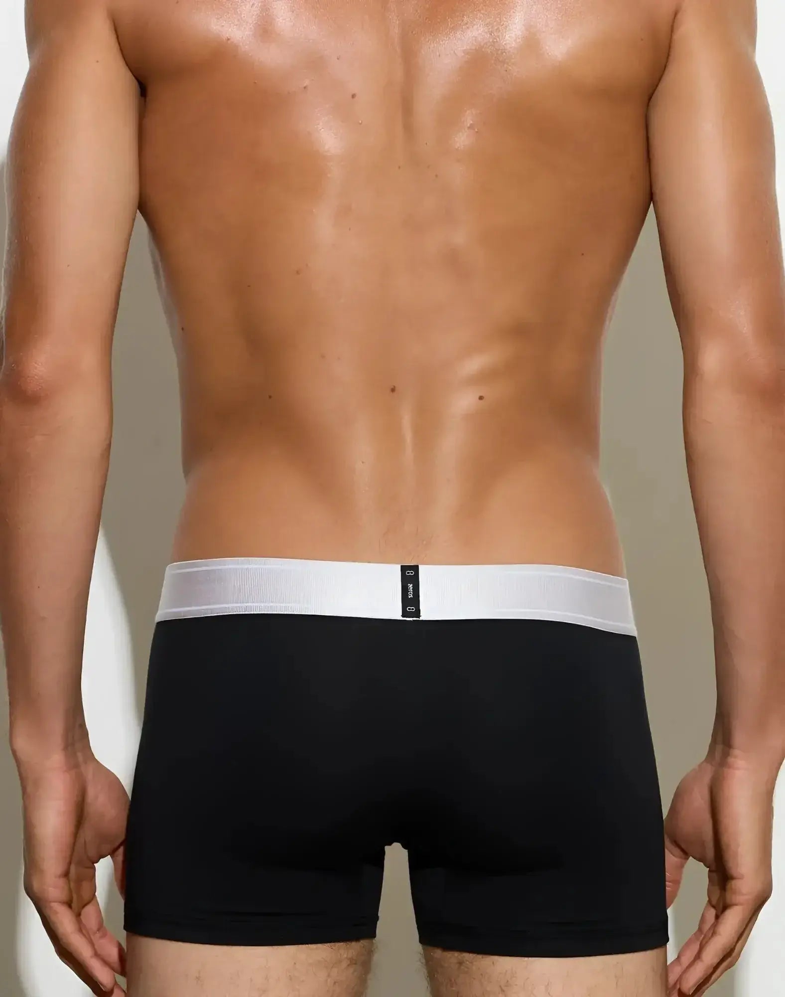 Back view of 2eros classic trunk underwear in black with white elastic waistband and small black tag on the back