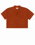 A rust-colored 2EROS cropped linen shirt with short sleeves collar and two front pockets in bombay brown