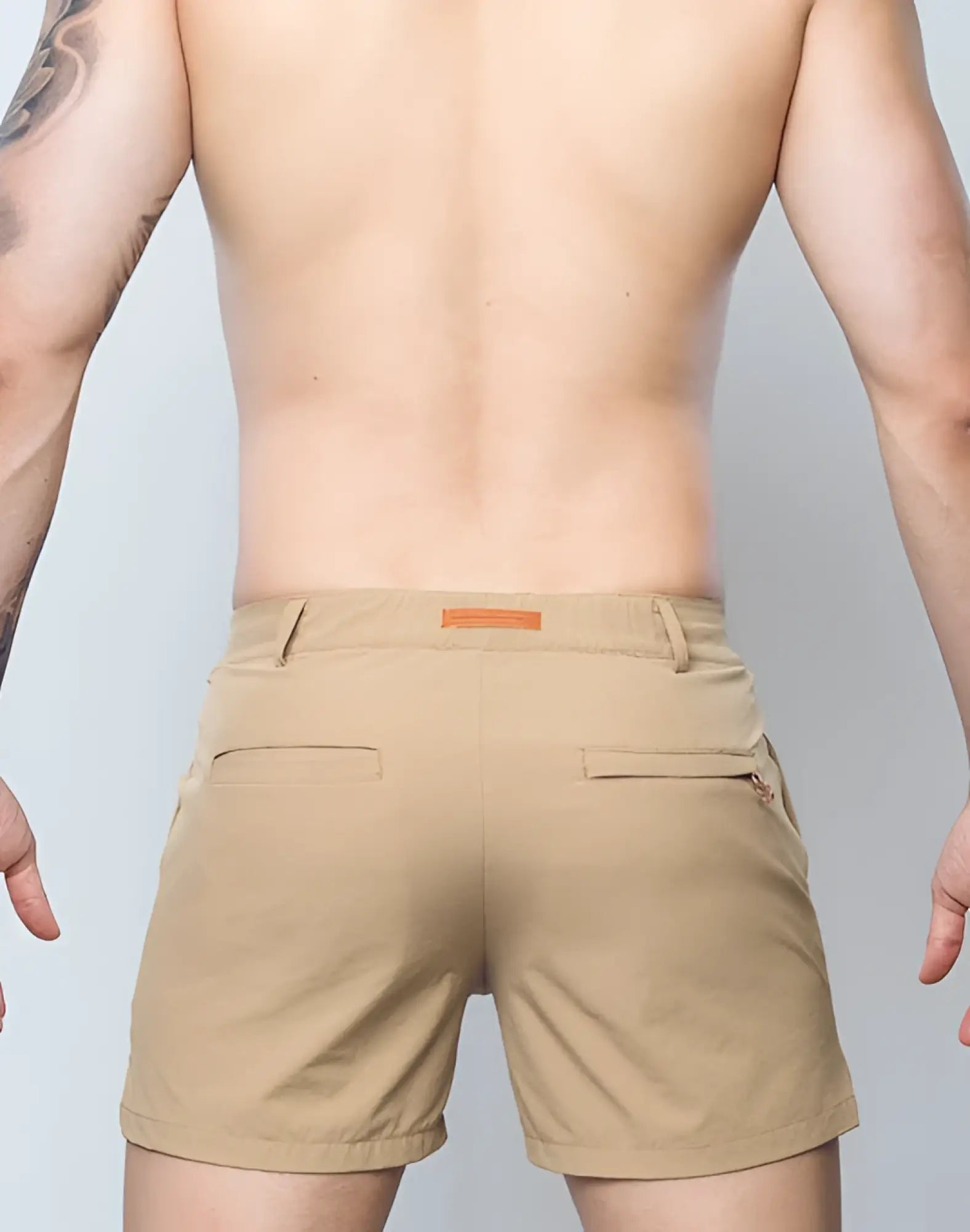 Beige textured fabric 2eros hamilton shorts in hazelnut with subtle woven pattern and orange brand tag at waistband
