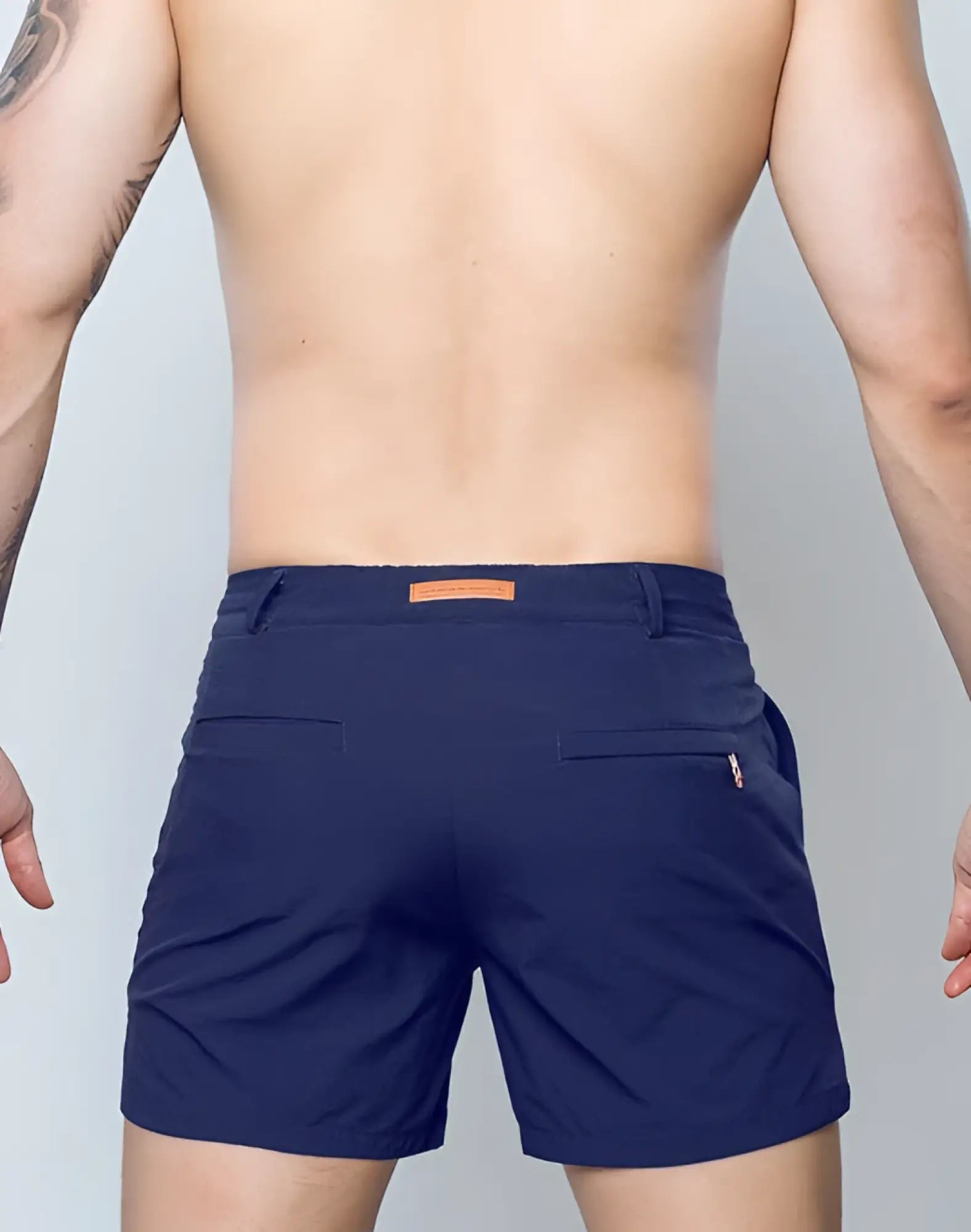 Navy blue 2EROS Hamilton shorts with textured fabric and orange belt loop and zipper detail for casual wear