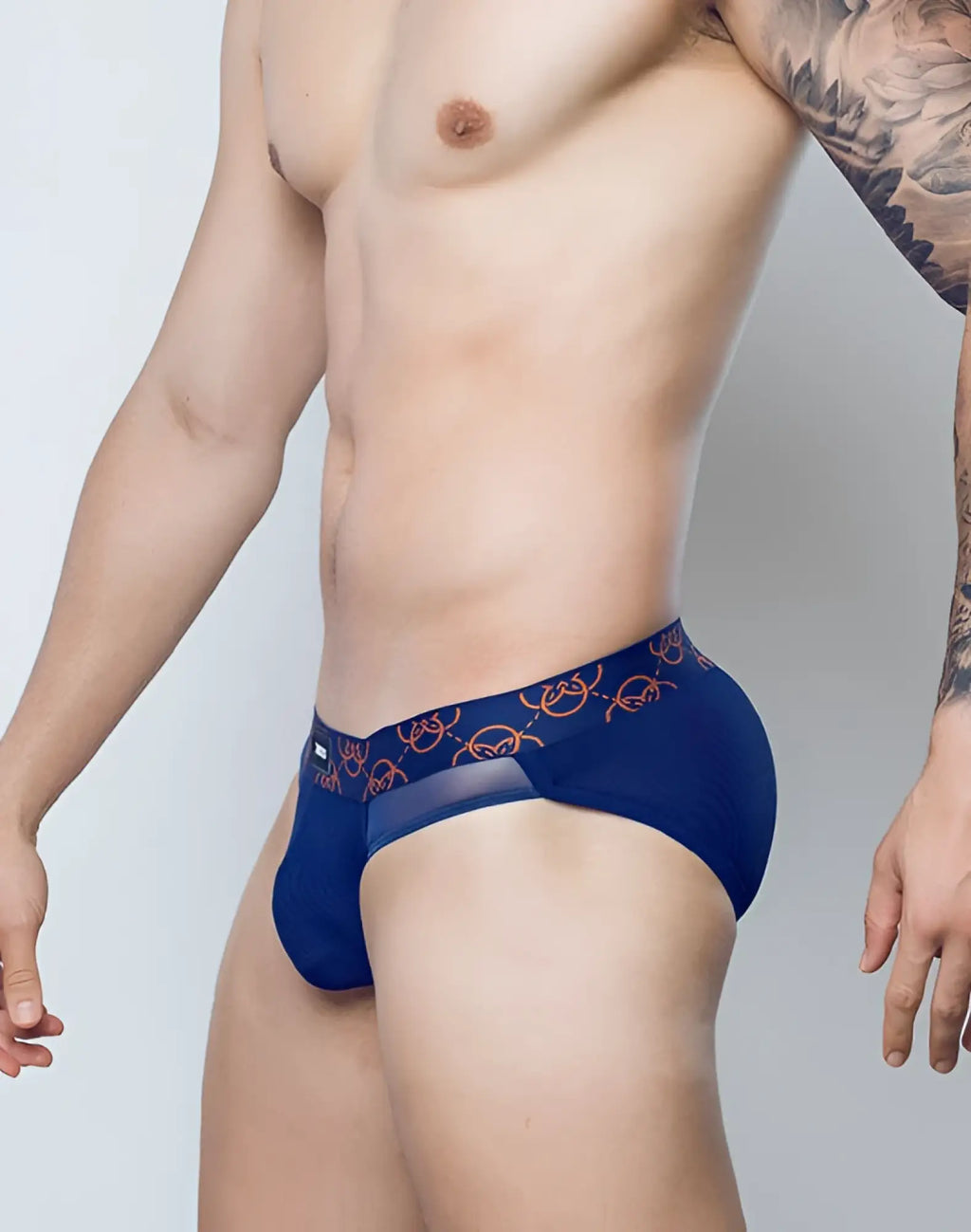 Navy blue 2EROS Himeros athletic briefs with a subtle orange chain-link pattern on the waistband
