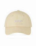 Beige 2EROS icon cap featuring an embroidered zeros logo in white thread on the front panel
