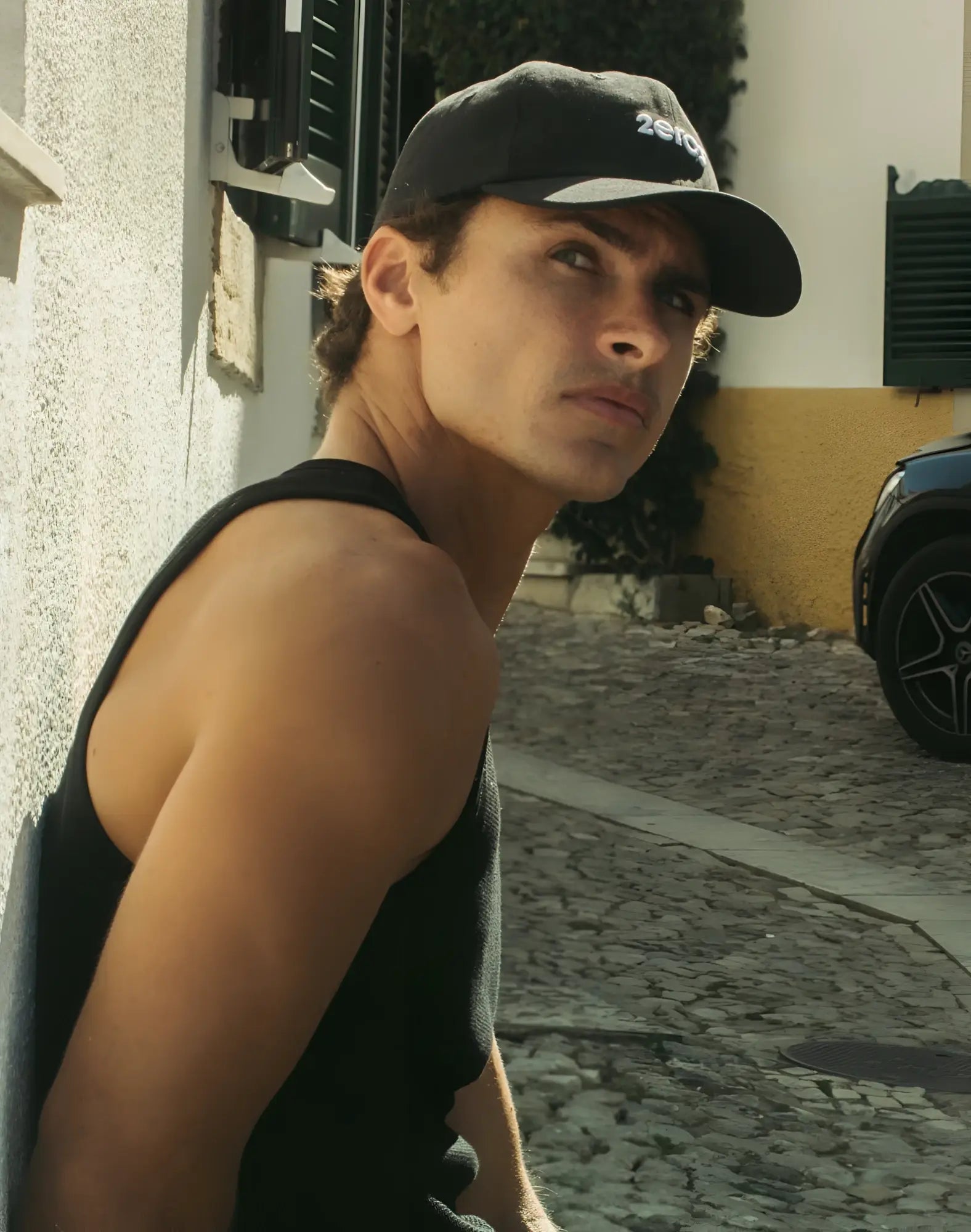 Black 2EROS icon cap featuring white 2019 logo on front made from comfortable fabric for casual wear