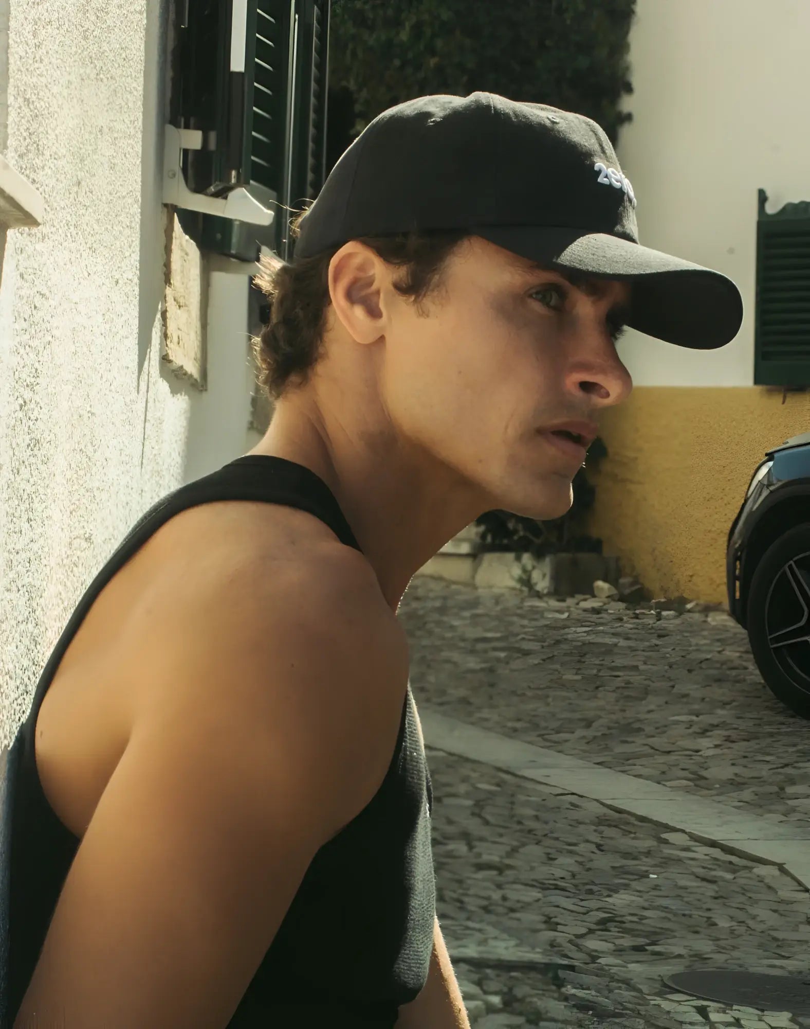 Black 2EROS icon cap featuring a white embroidered logo made from durable fabric for casual wear