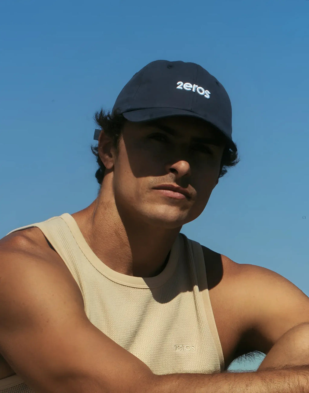 Navy blue 2EROS icon cap with white embroidered 2eros logo on front, made from breathable fabric for casual wear