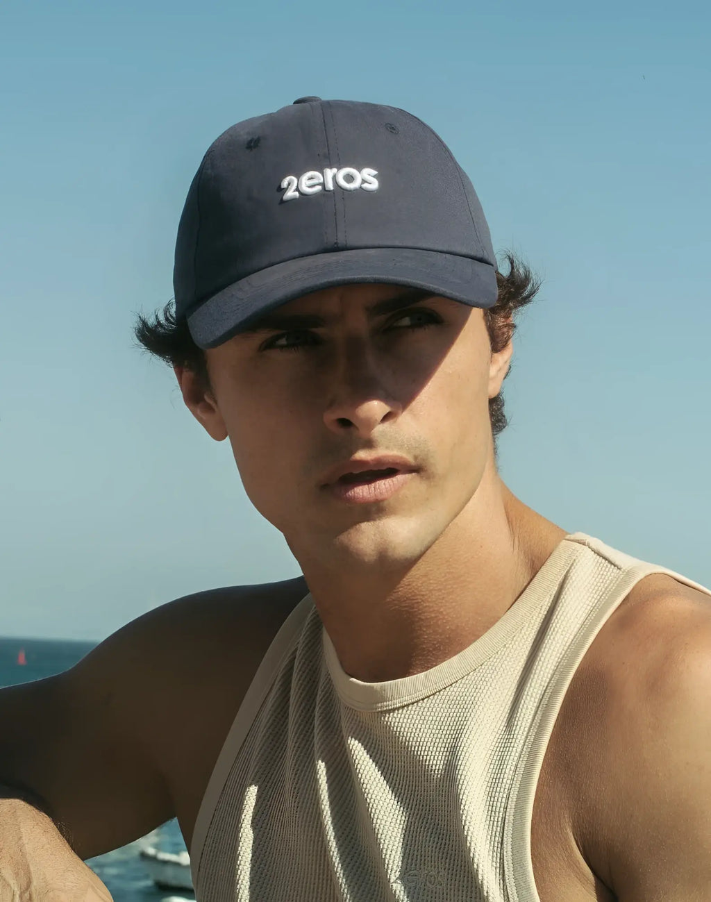 Navy blue baseball cap with white 2eros logo embroidered on front in 2eros icon cap navy design
