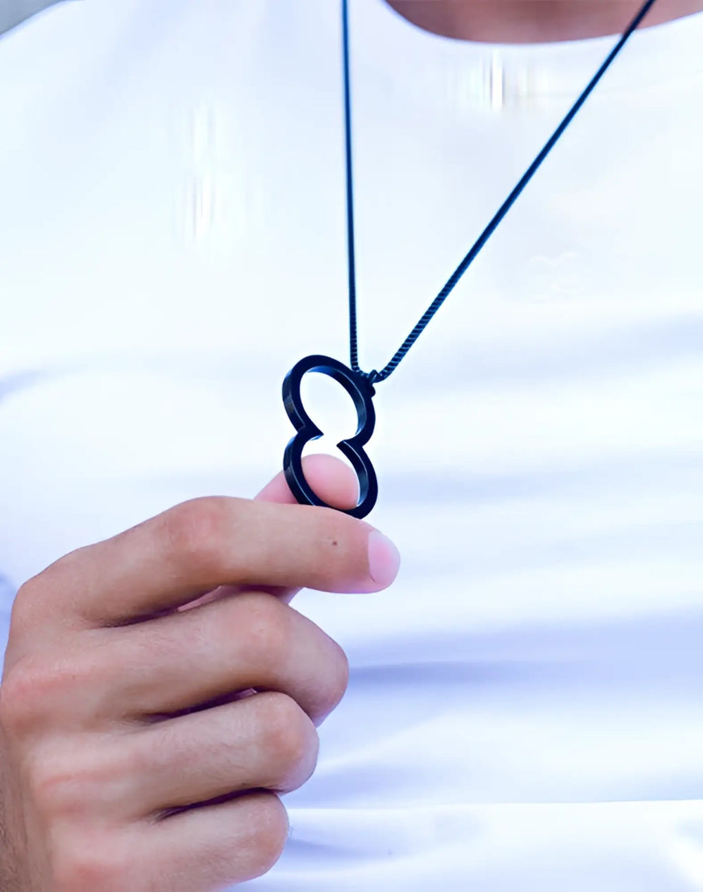 Black 2EROS icon pendant necklace featuring a sleek infinity symbol with a minimalist design