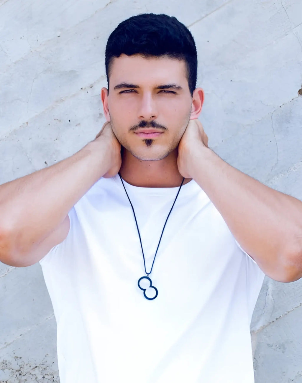Black infinity symbol pendant necklace by 2eros on a thin cord featuring a sleek black finish