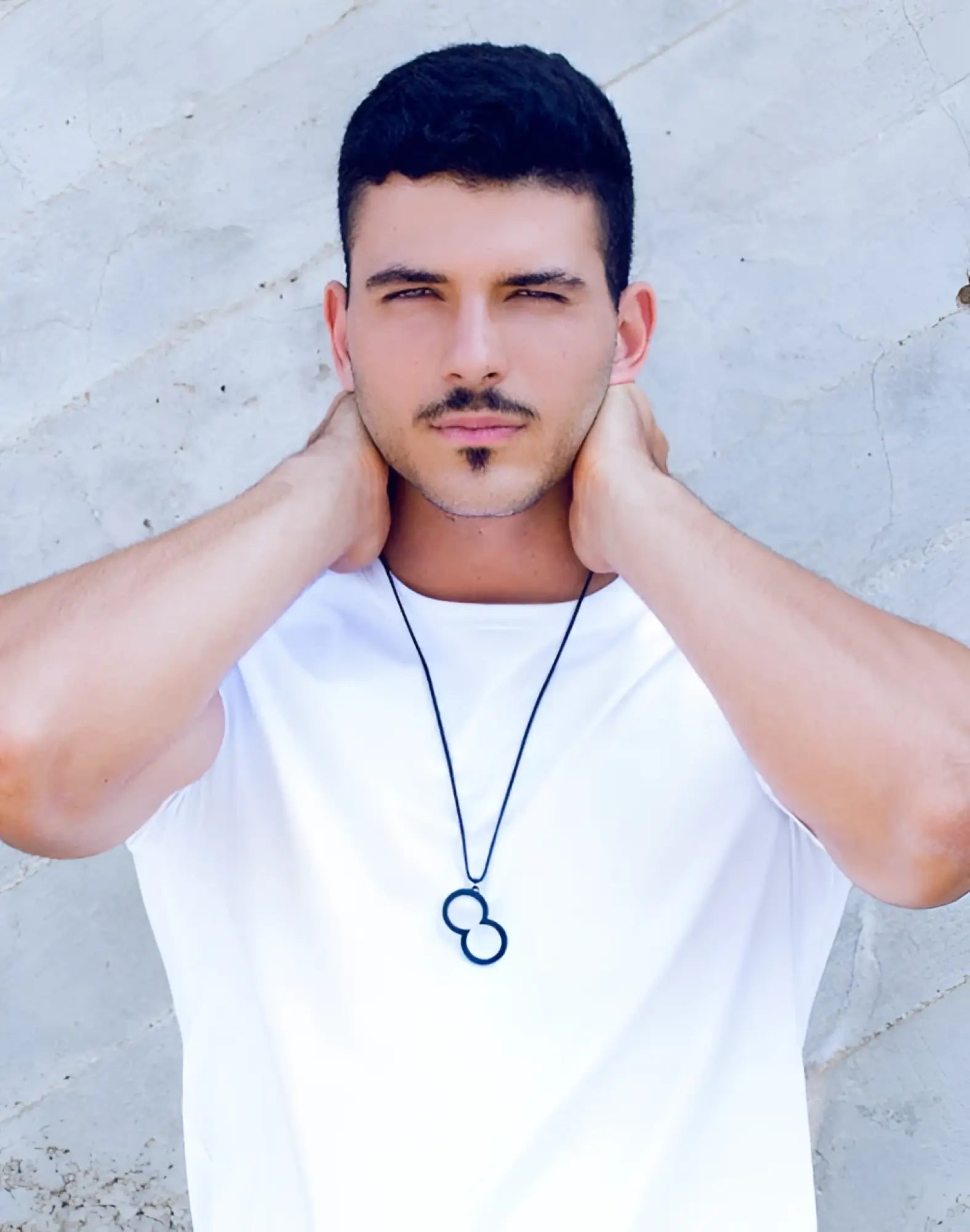 Black infinity symbol pendant necklace by 2eros on a thin cord featuring a sleek black finish