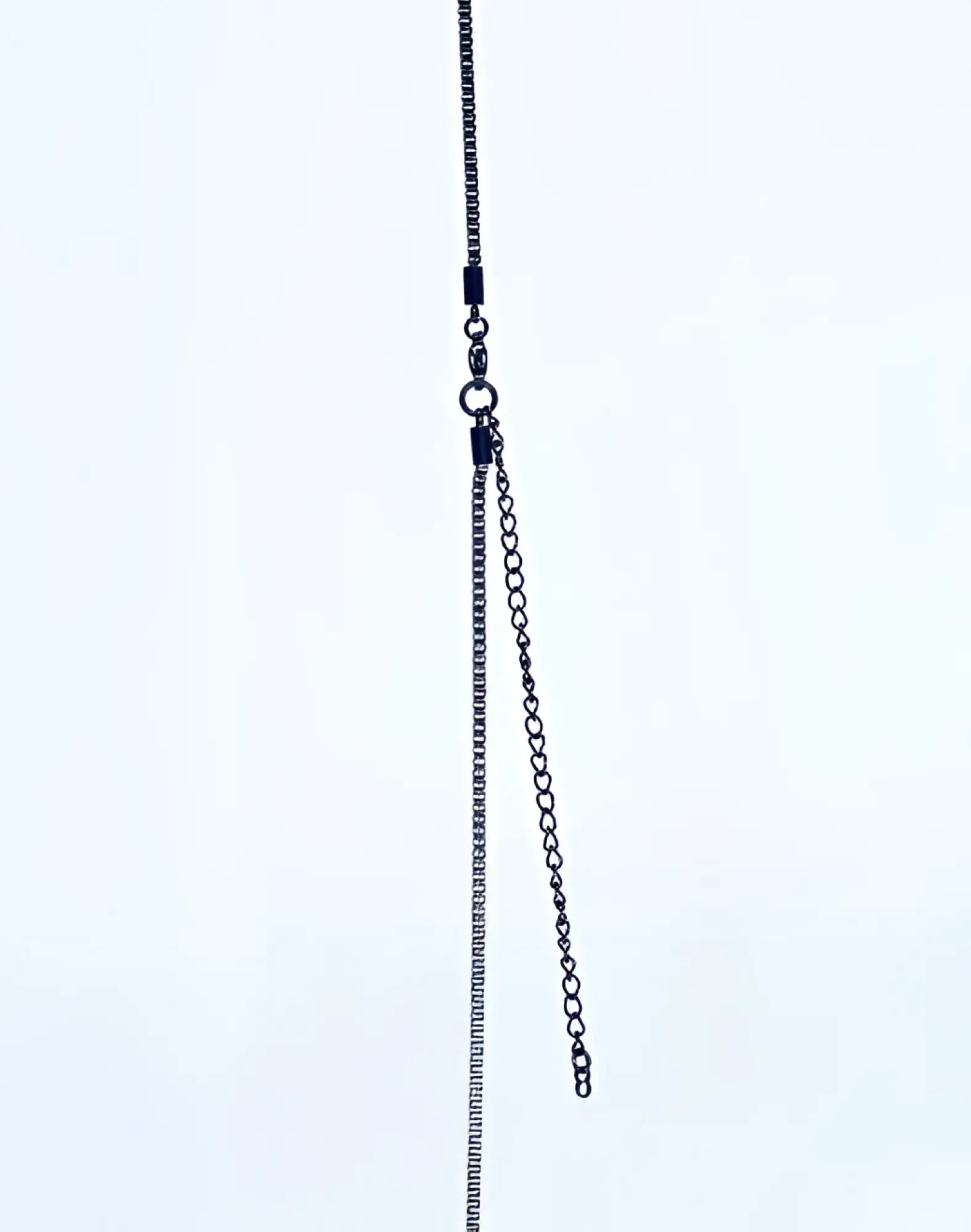 2EROS icon pendant necklace in black featuring a sleek oxidized metal chain with a small extension link