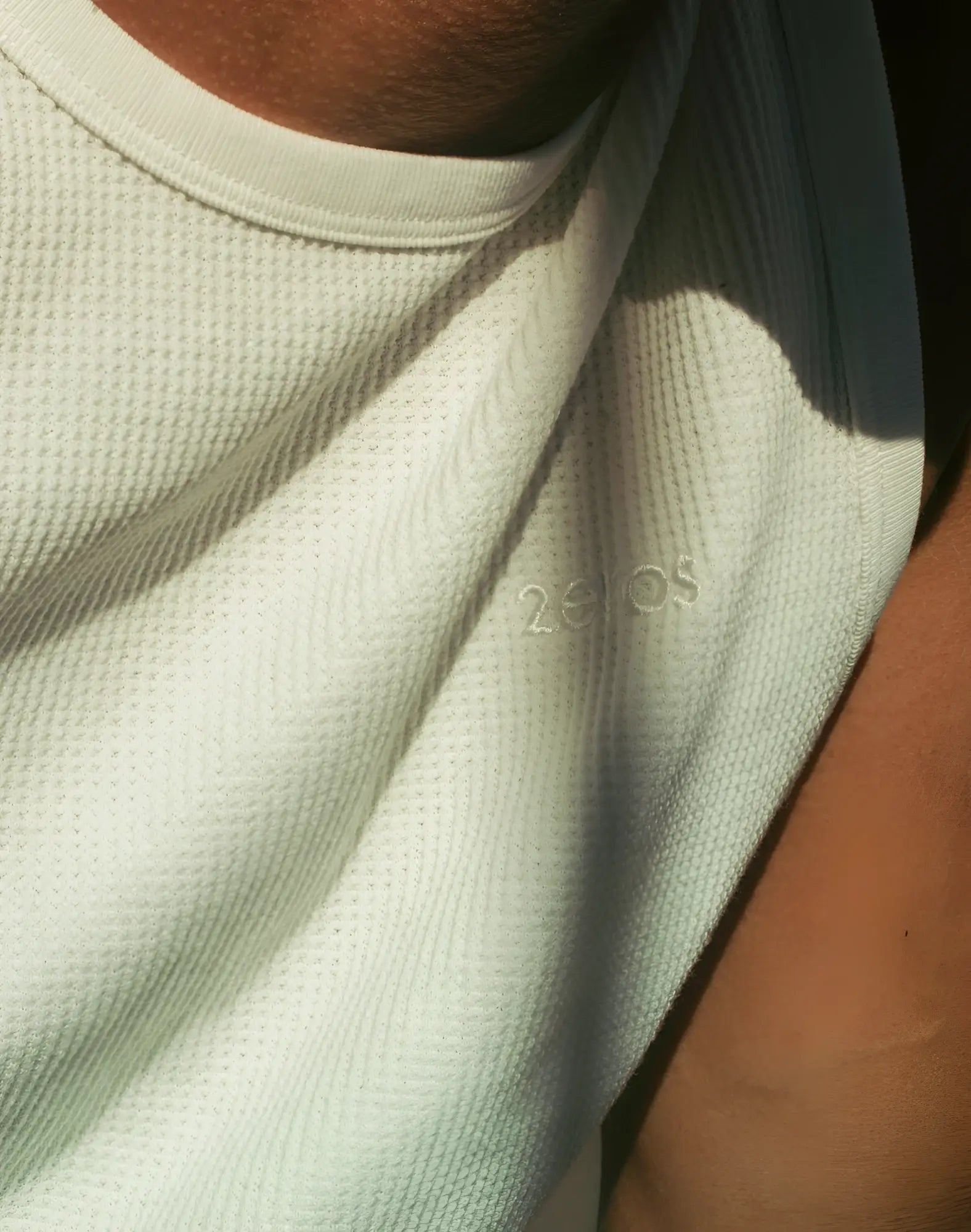 2EROS icon singlet white light green textured mesh t-shirt with subtle 20os logo embroidered on the chest
