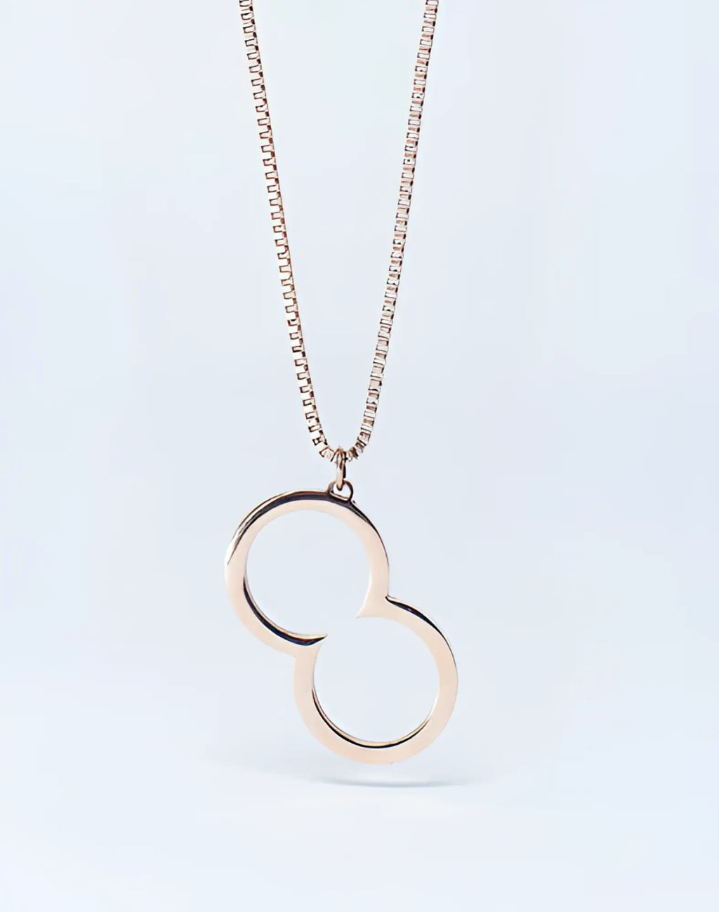 Rose gold 2eros logo pendant necklace featuring an infinity symbol on a matching box chain