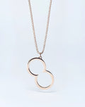 Rose gold 2eros logo pendant necklace featuring an infinity symbol on a matching box chain