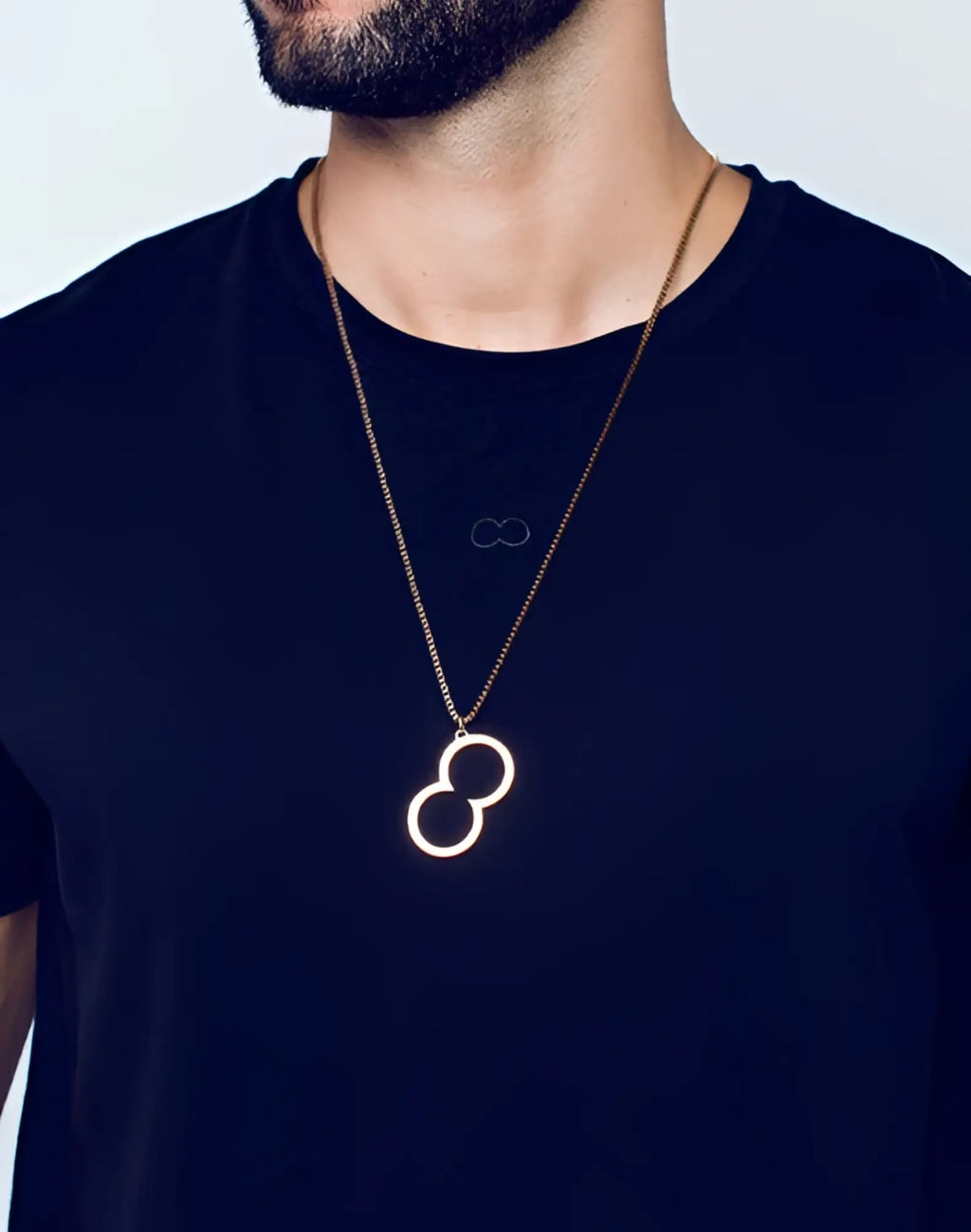 Rose gold 2eros logo pendant necklace with gold toned infinity symbol on a delicate chain