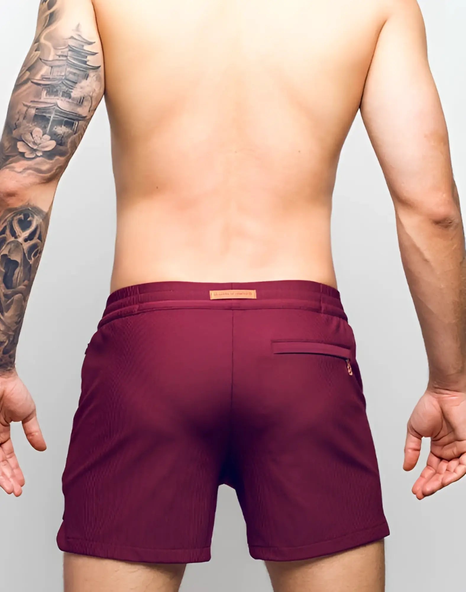 2eros manly shorts tibetan red maroon corduroy swim trunks with subtle ribbed texture and brand tag at waistband