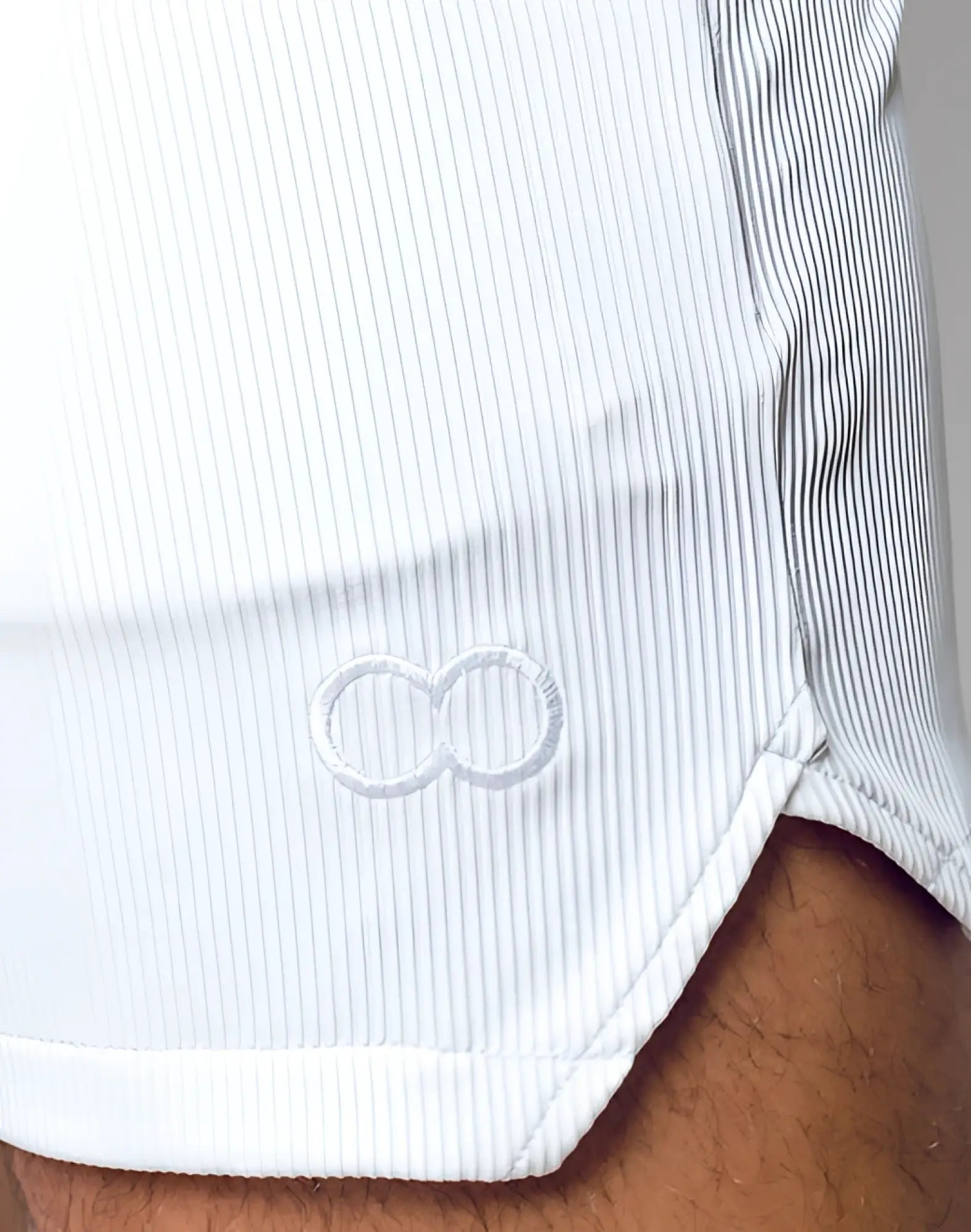 White ribbed cotton 2EROS manly shorts with a subtle embroidered infinity symbol at the hem