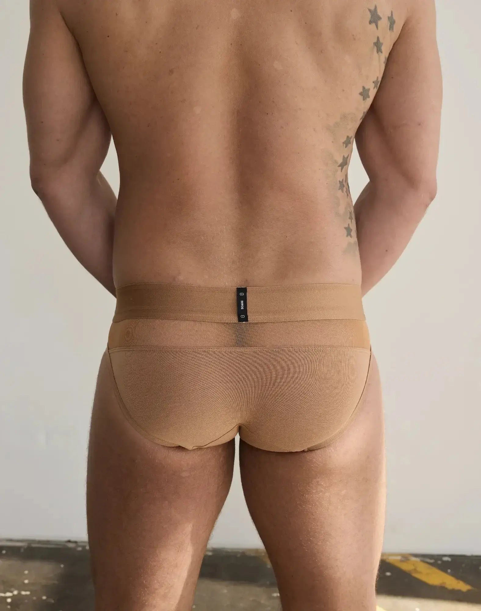 Tan 2EROS Morpheus form-fitting briefs with textured mesh pattern and narrow waistband featuring black label