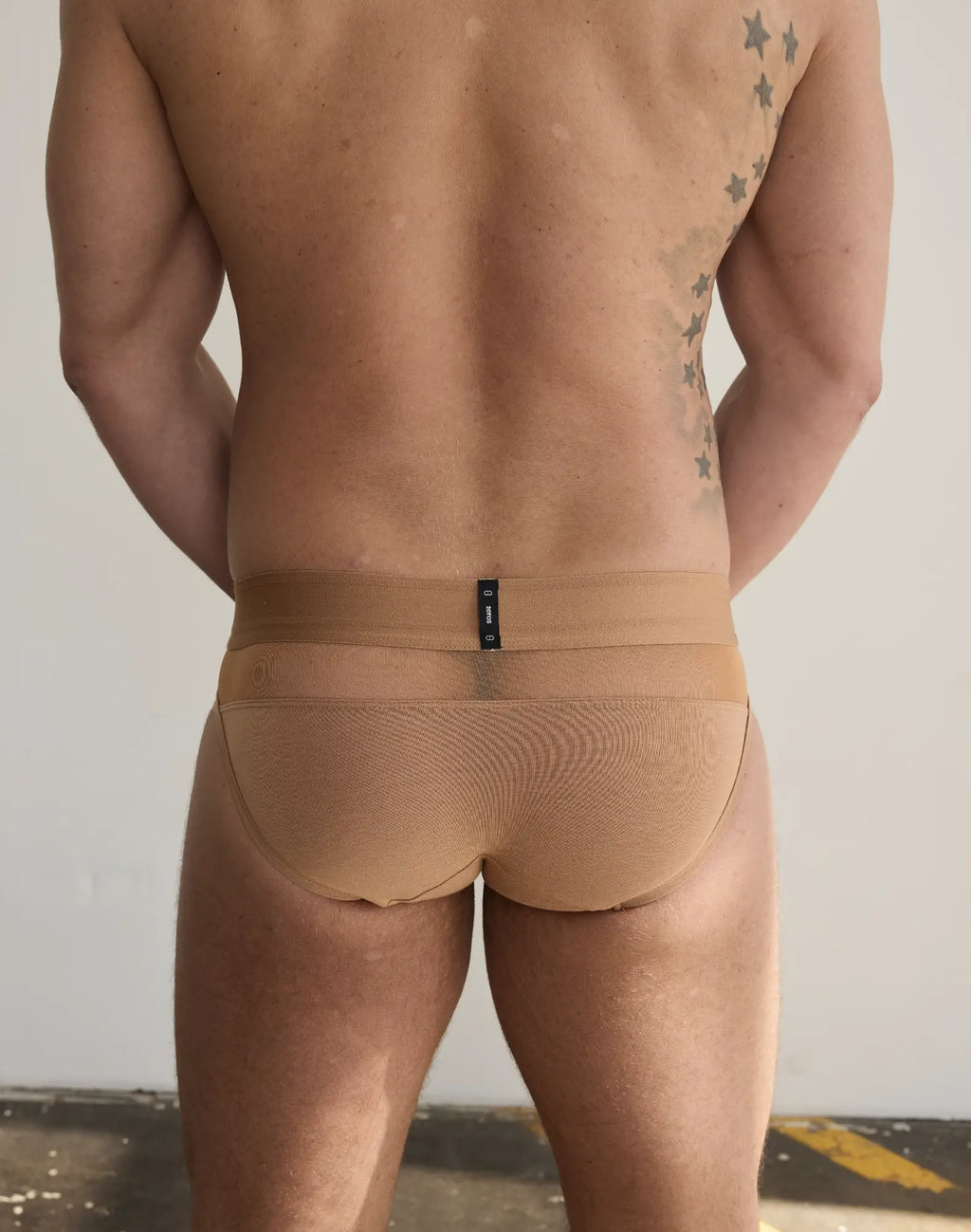 Tan 2EROS Morpheus form-fitting briefs with textured mesh pattern and narrow waistband featuring black label