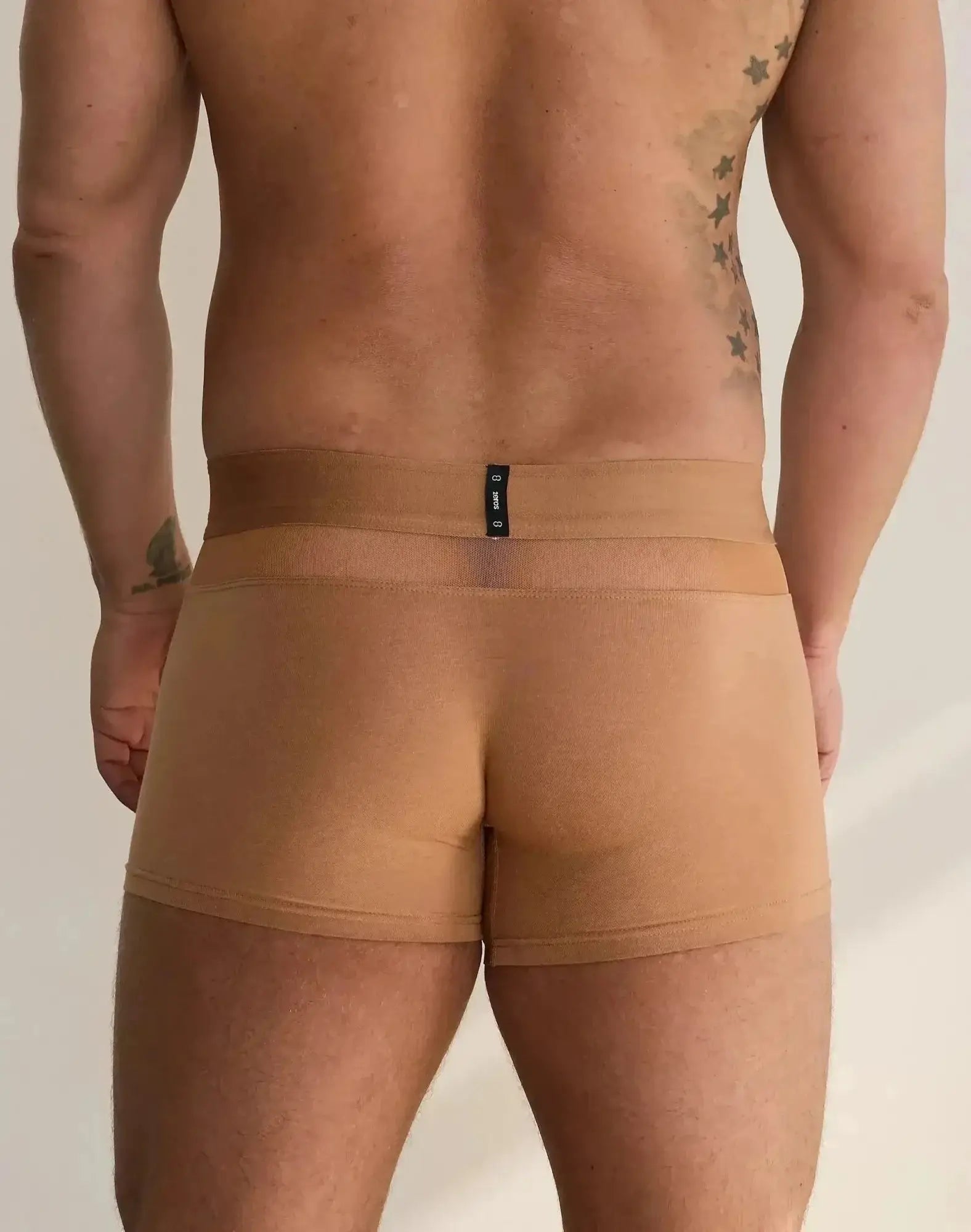 Tan seamless briefs with black 2eros brand tag at waistband from morpheus trunk underwear brown collection