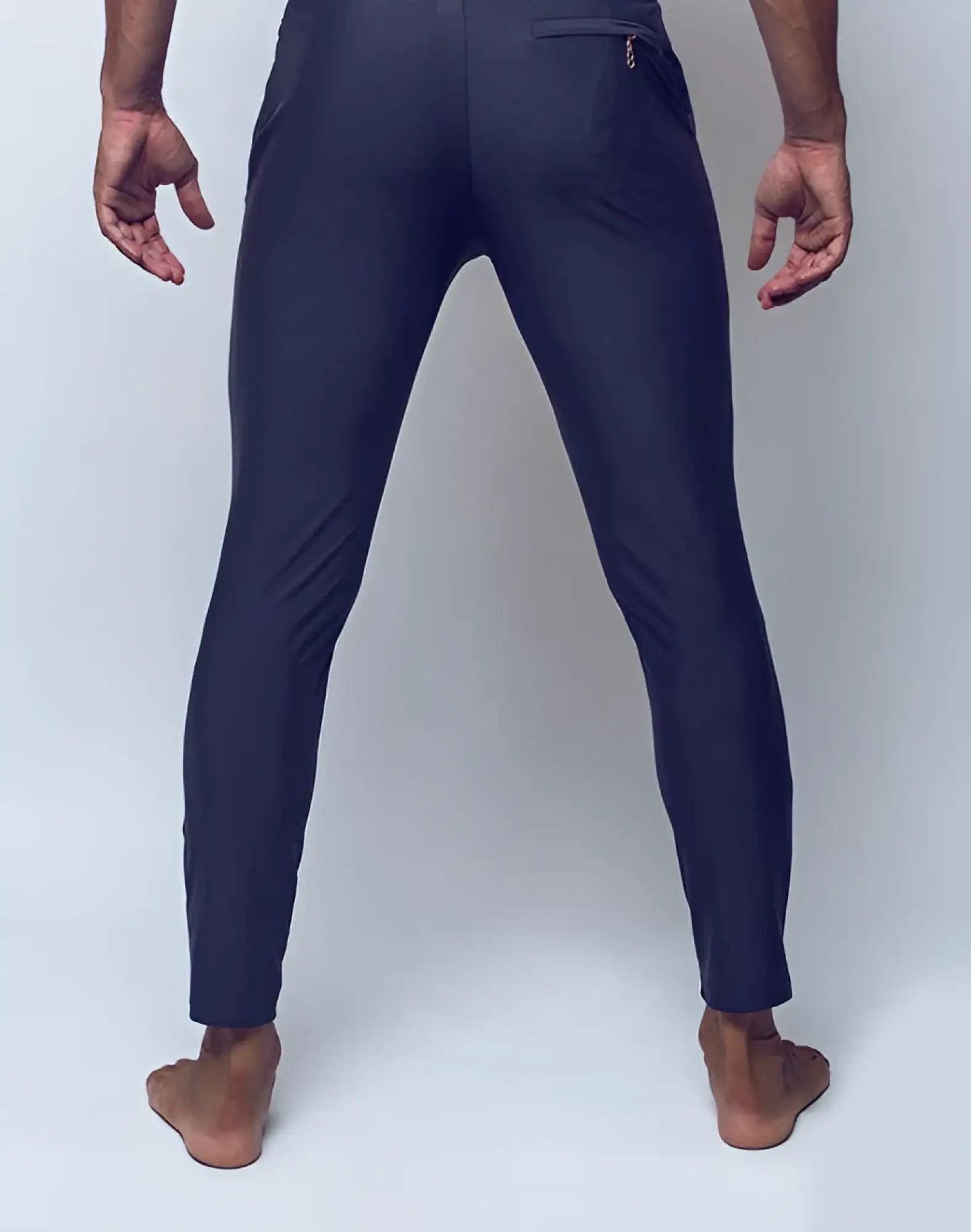 Dark navy blue slim-fit 2eros p60 bondi pants showing subtle rear pocket zipper detail from the back side
