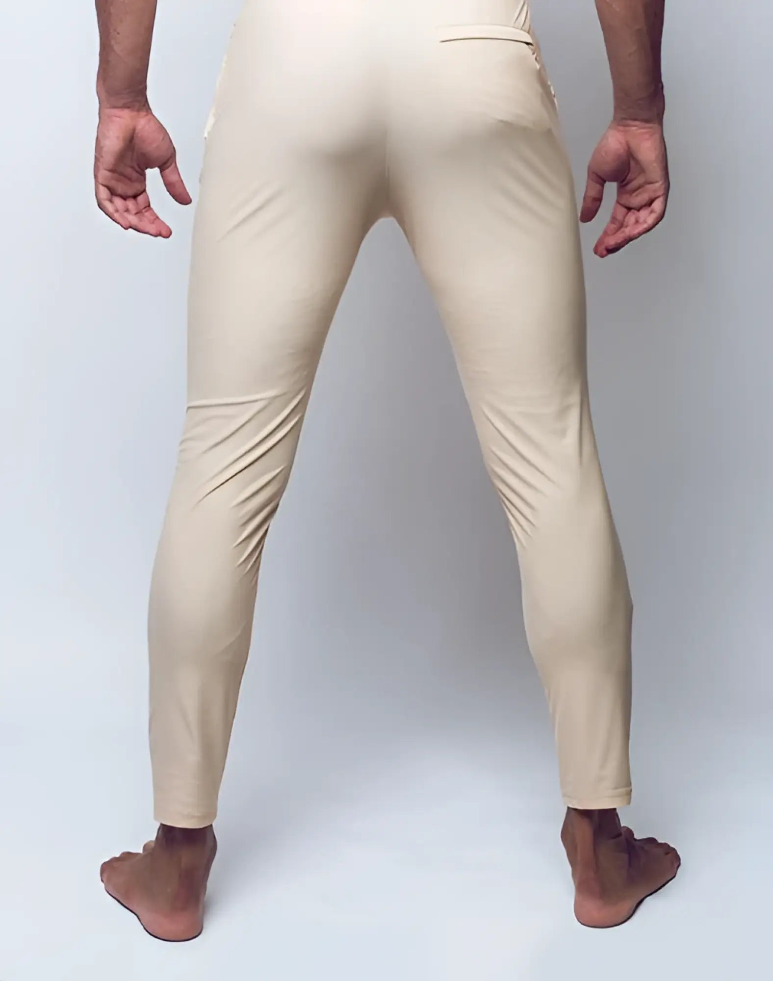 Cream-colored form-fitting 2eros p60 bondi pants in sleek stretchy material with subtle seam detailing in sand color