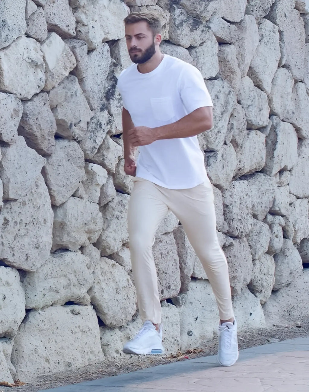 White crewneck t-shirt with chest pocket paired with 2eros p60 bondi pants in sand color for casual wear