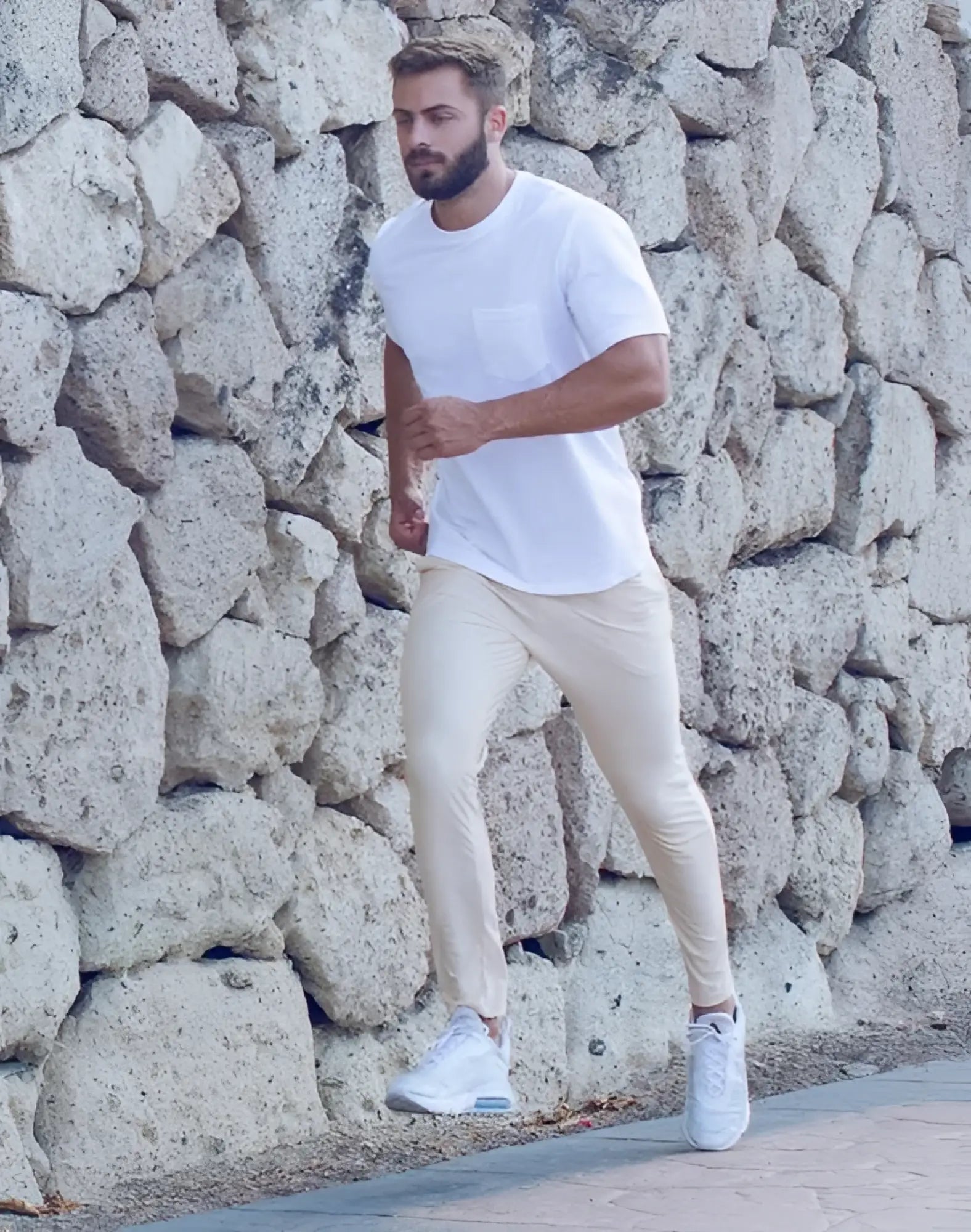 White crewneck t-shirt with chest pocket paired with 2eros p60 bondi pants in sand color for casual wear