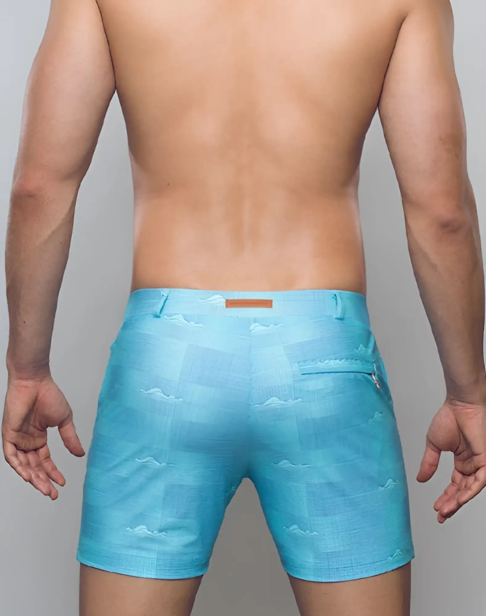 Light blue 2EROS printed bondi shorts with a subtle mountain pattern and brown leather tab at the waistband