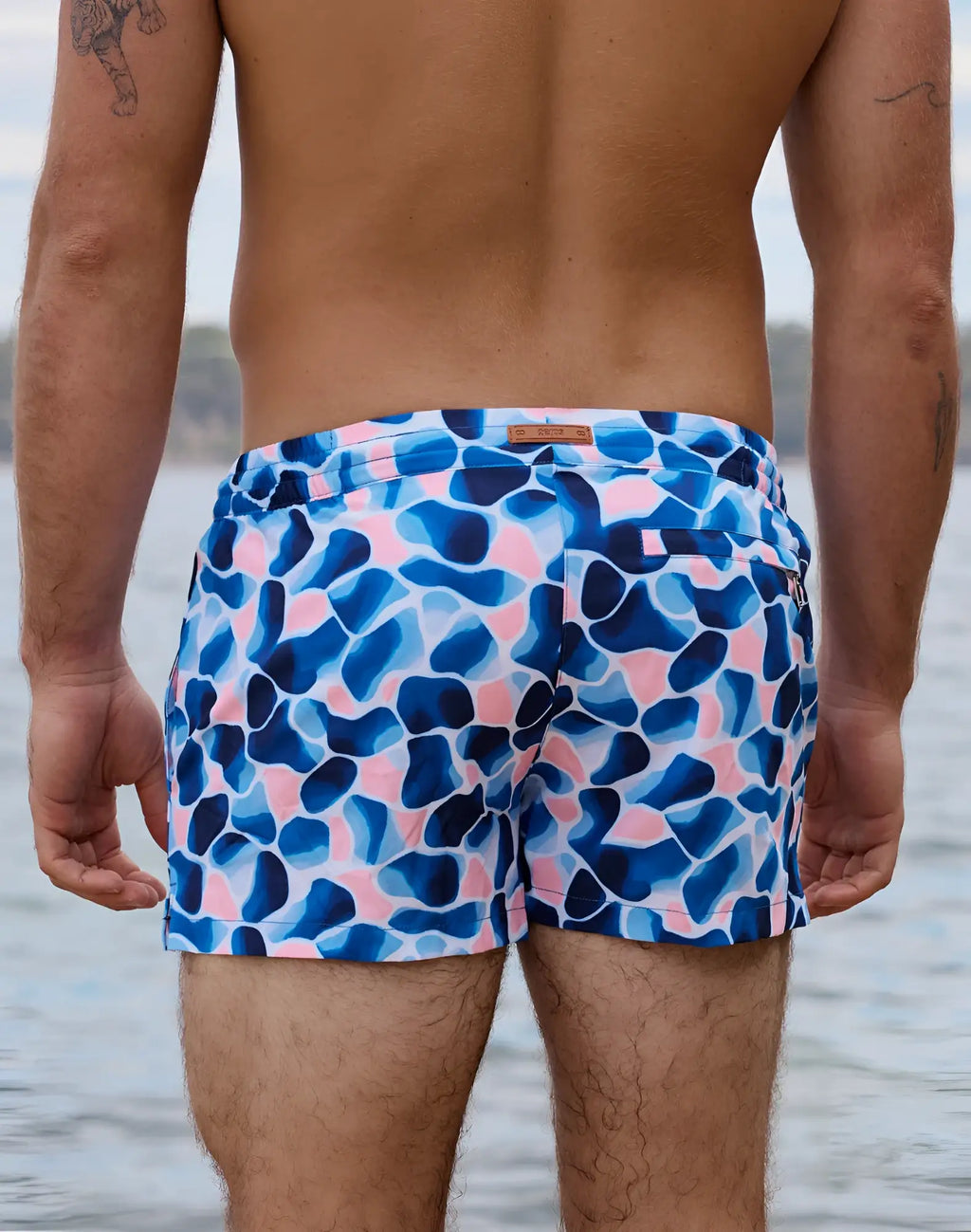2EROS printed Bronte shorts in aqua navy feature blue and pink abstract patterns designed for swimwear