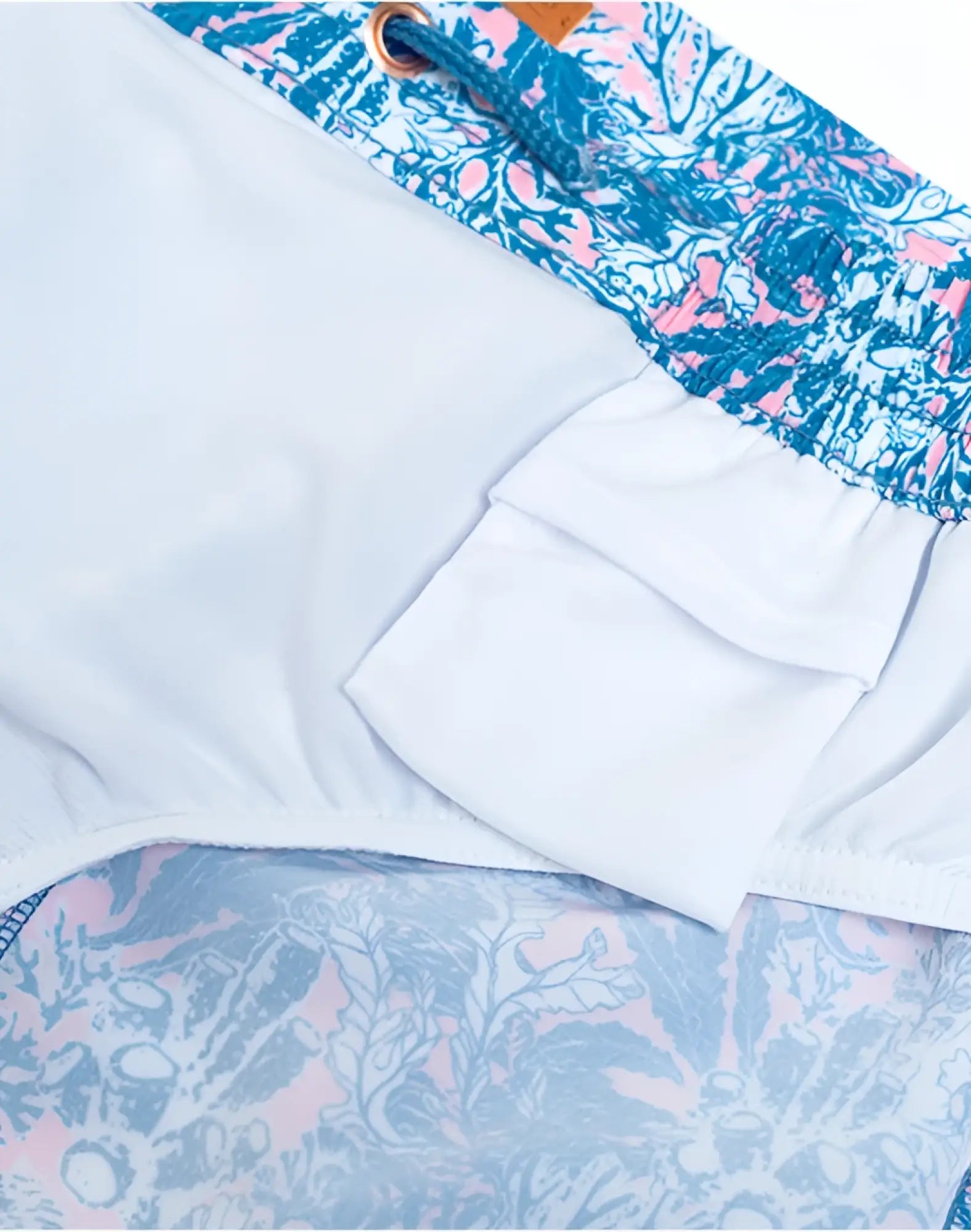 2eros printed Bronte shorts in coral teal with blue and pink floral swim trunks and white interior lining