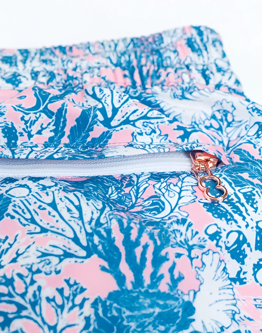 2eros printed bronte shorts coral teal swim trunks with blue and pink coral pattern and rose gold zipper pull