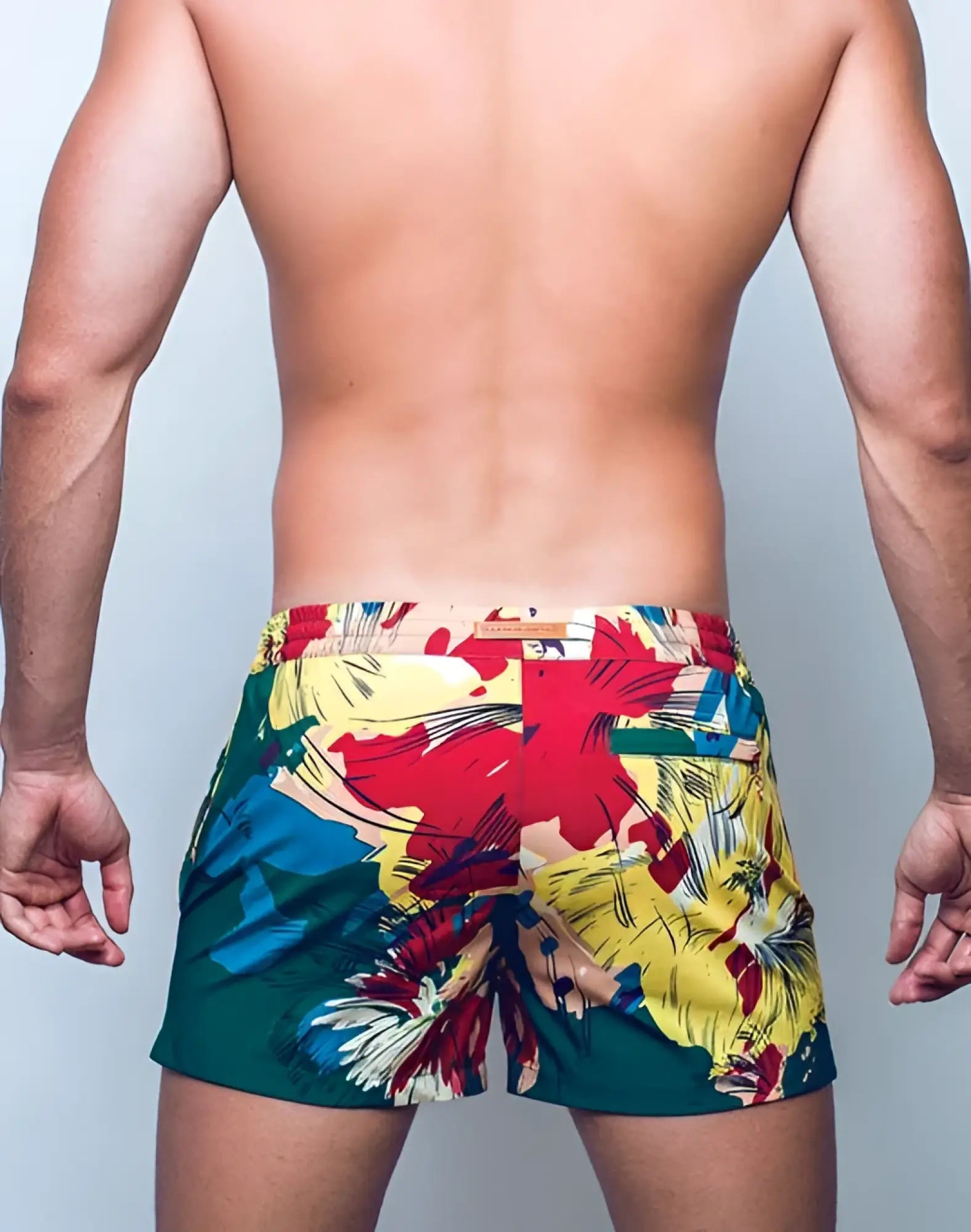 2eros printed bronte shorts with vibrant red yellow and teal tropical floral print swim trunks front view