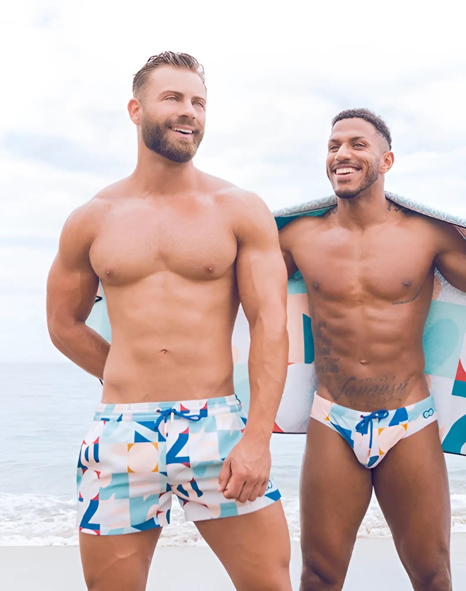 Men’s 2EROS printed Bronte shorts in insignia turquoise with light blue white and orange geometric swim trunk design