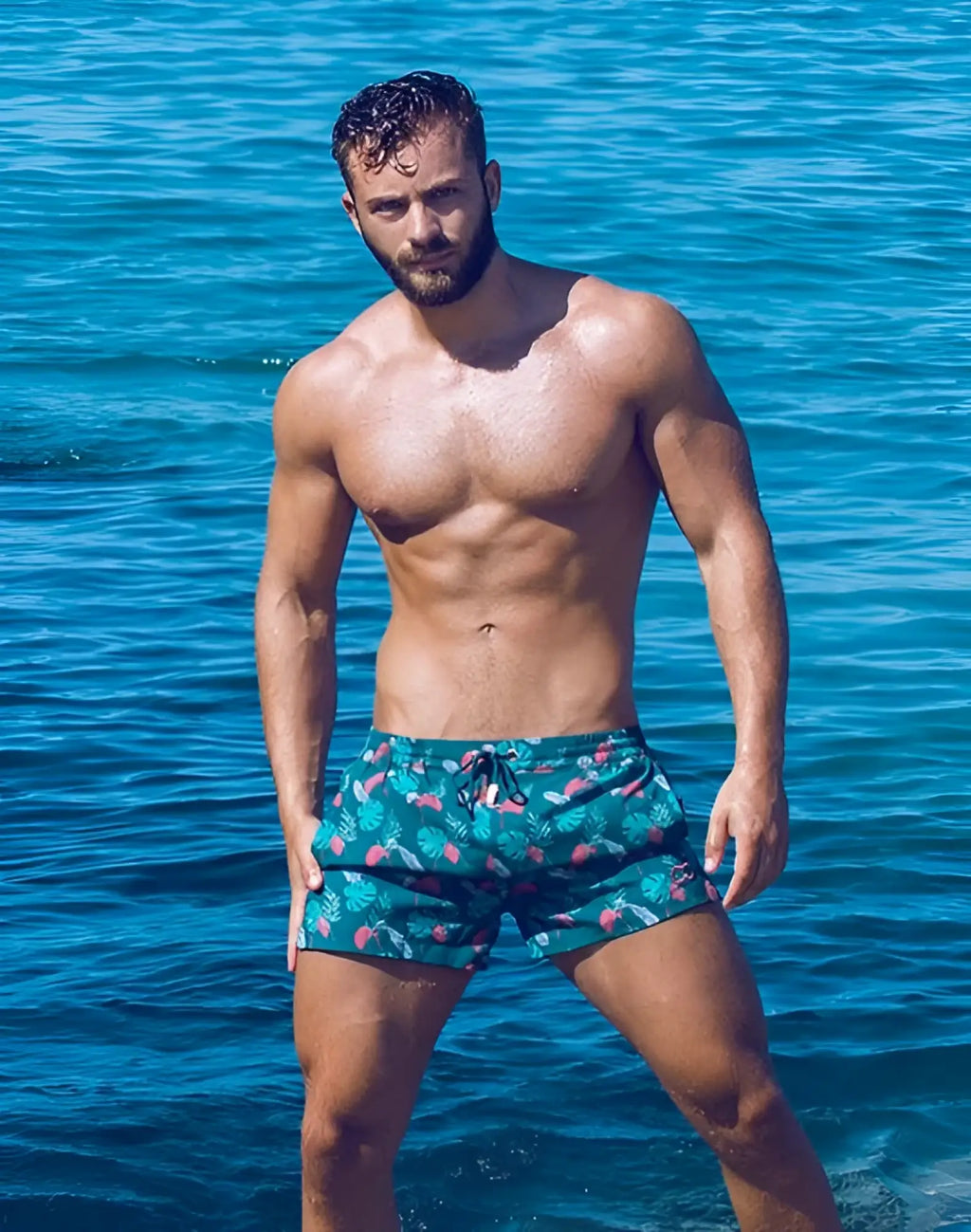 Teal 2EROS printed Bronte swim shorts with tropical monstera leaf and pink flamingo pattern for beachwear
