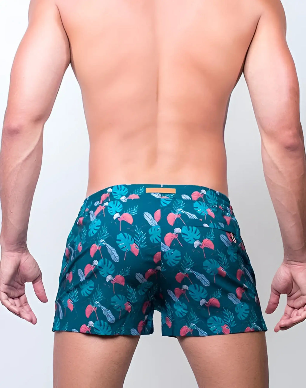 Teal 2EROS printed Bronte shorts with vibrant tropical leaf and pink flamingo pattern swim trunks for beachwear