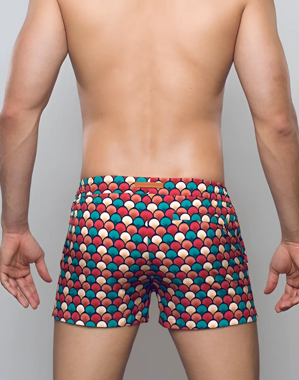 2EROS printed Bronte shorts featuring multicolored scallop-patterned swim trunks in retro red teal and beige tones