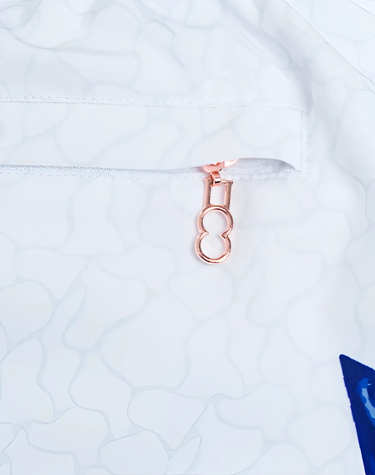 Rose gold zipper pull with double loop design on 2eros printed bronte shorts seascape white