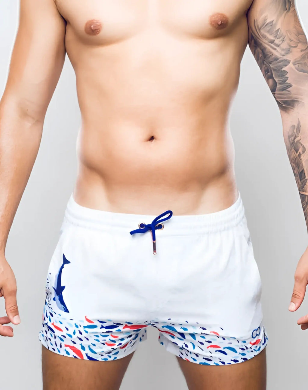 2EROS printed Bronte white swim trunks with blue whale graphic colorful fish pattern and matching blue drawstring