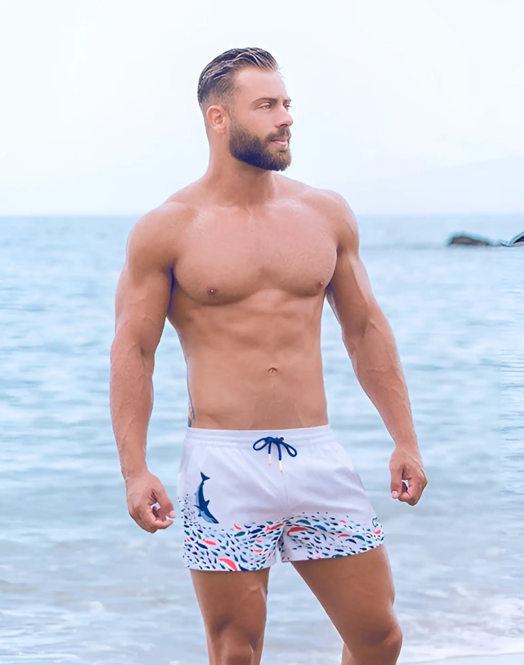 White swim trunks 2EROS printed bronte shorts with colorful fish dolphin pattern and blue drawstrings seascape white