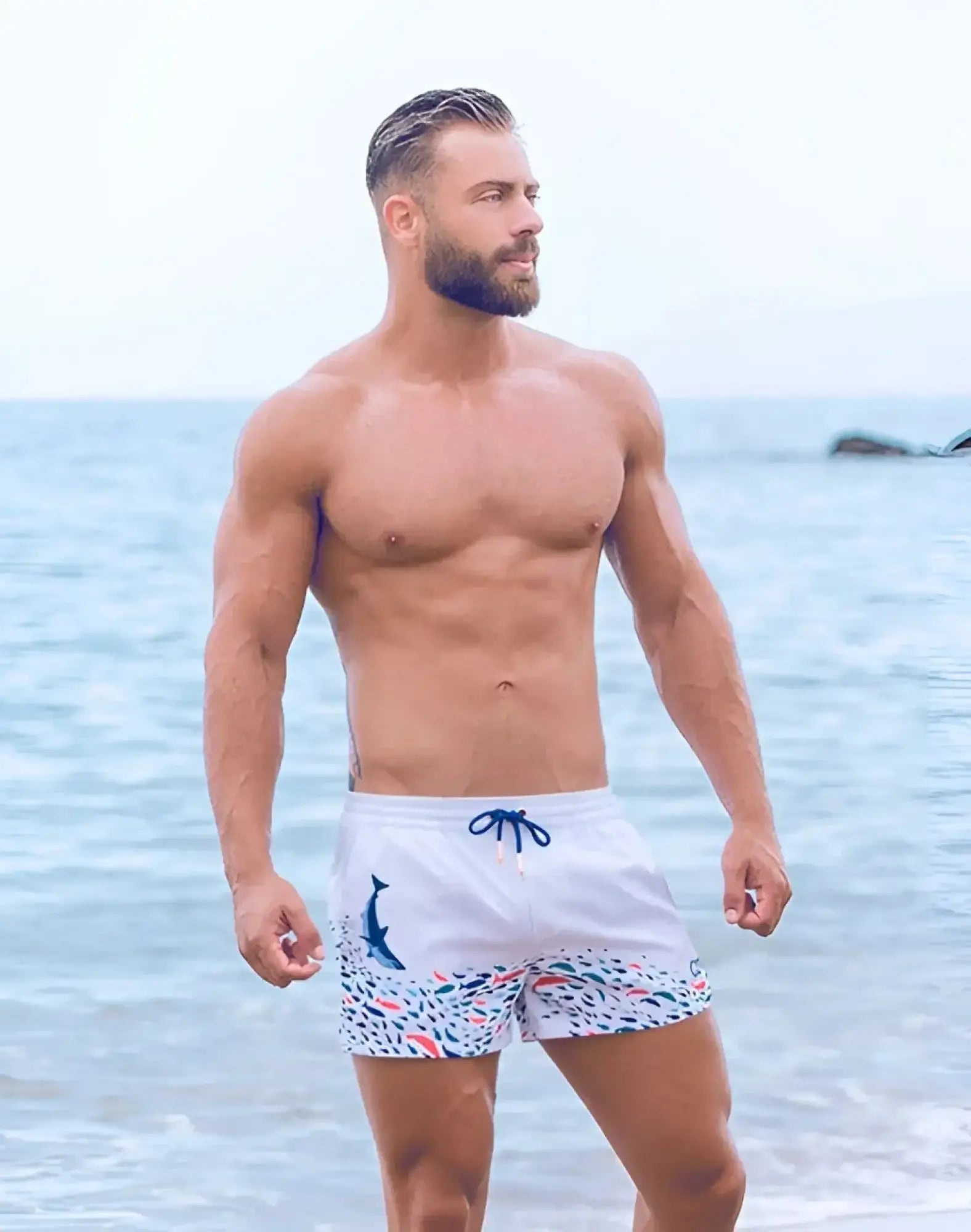 White swim trunks 2EROS printed bronte shorts with colorful fish dolphin pattern and blue drawstrings seascape white